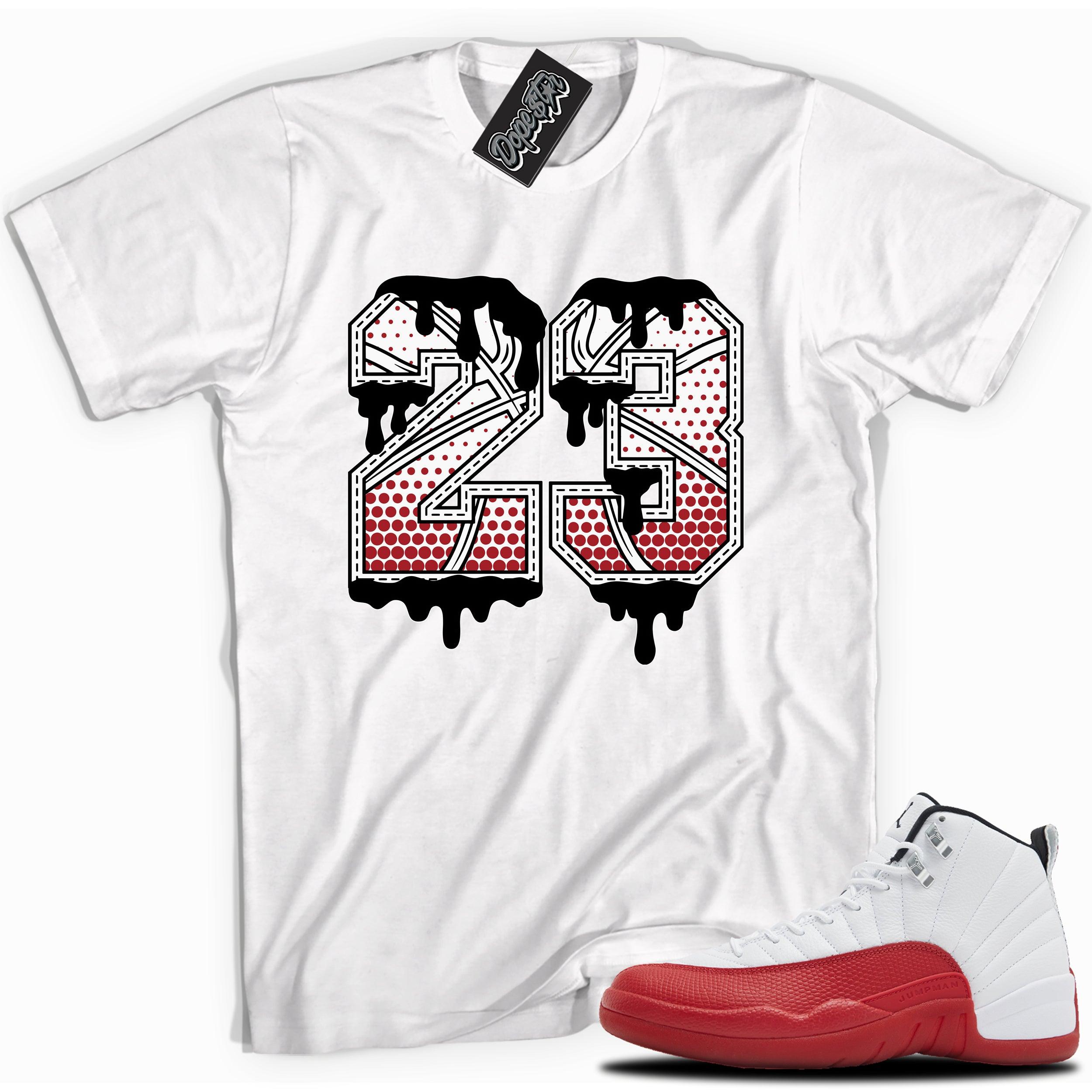 Cool White graphic tee with “ 23 Ball ” print, that perfectly matches Air Jordan 12 Retro Cherry Red 2023 red and white sneakers 