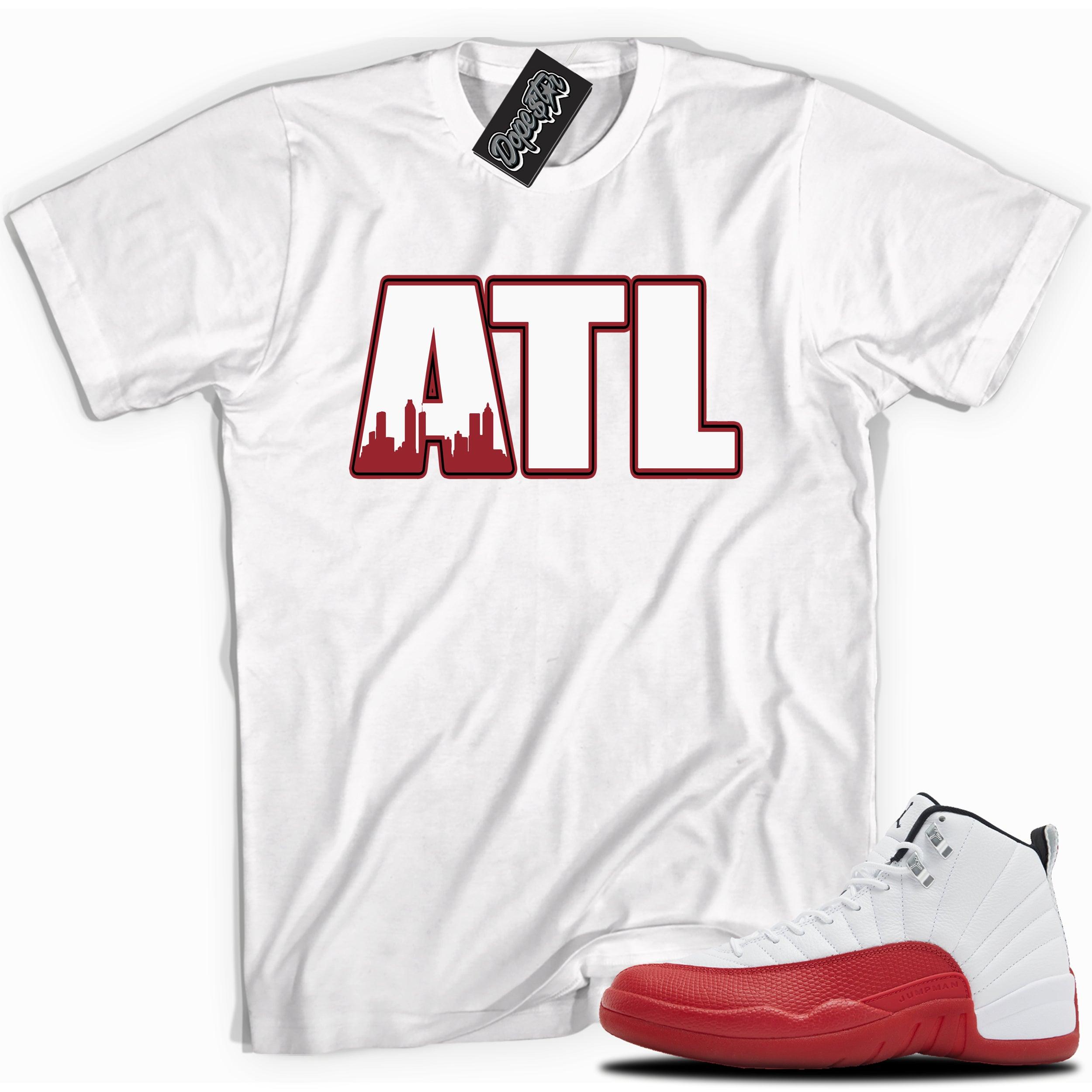 Cool White graphic tee with “ ATLANTA ” print, that perfectly matches Air Jordan 12 Retro Cherry Red 2023 red and white sneakers
