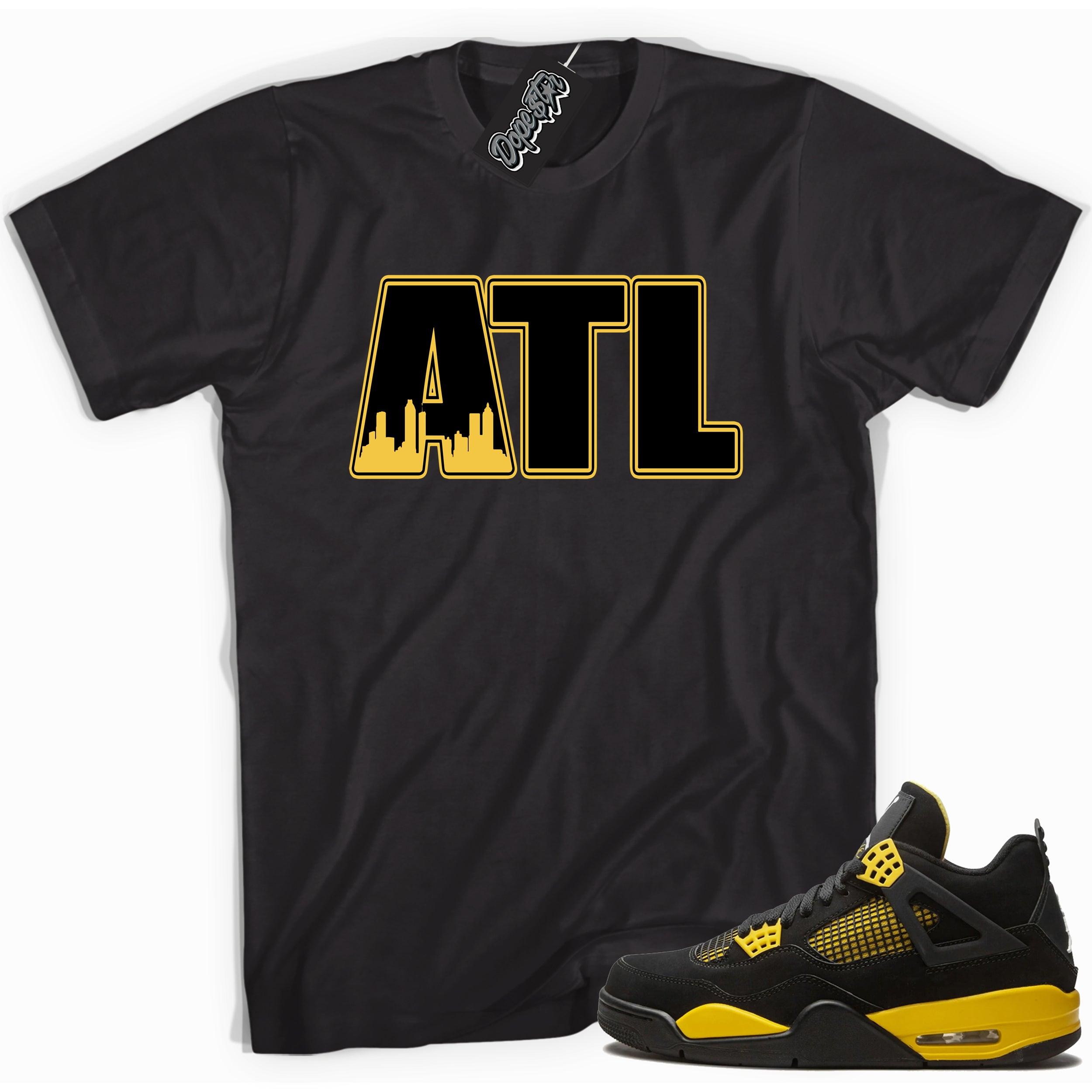 Cool black graphic tee with 'ATL Atlanta' print, that perfectly matches Air Jordan 4 Thunder sneakers