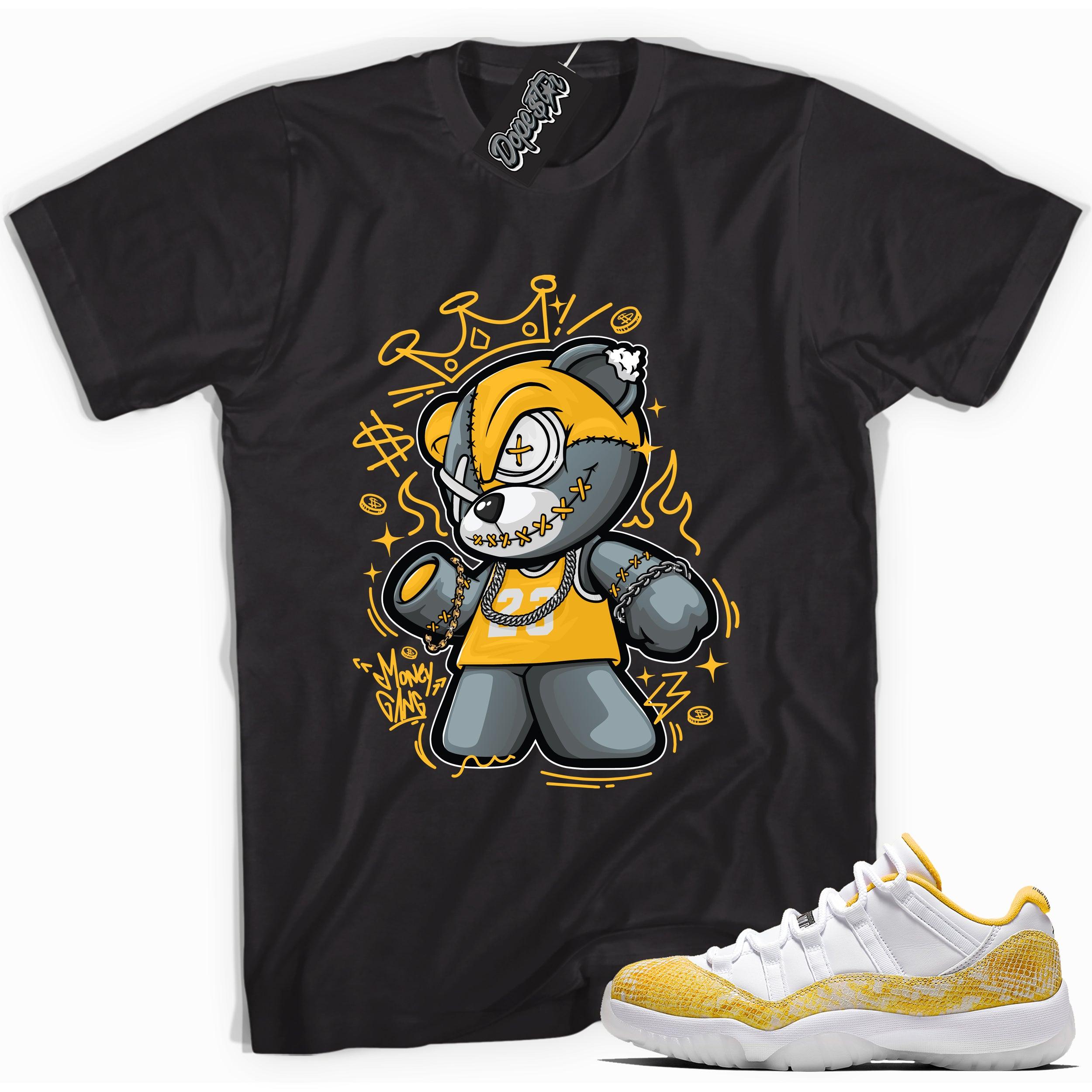 Cool black graphic tee with 'money gang bear' print, that perfectly matches Air Jordan 11 Retro Low Yellow Snakeskin sneakers