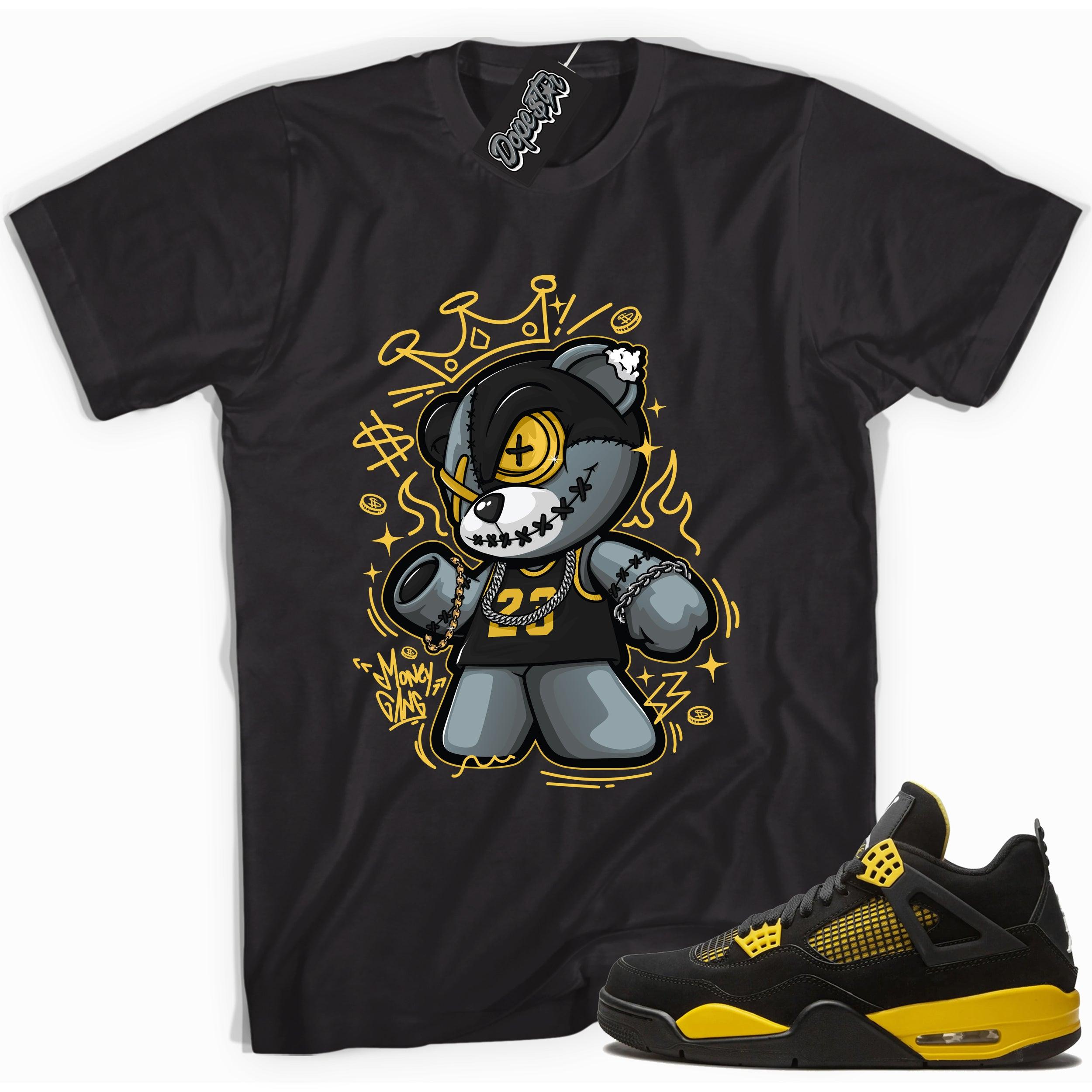 Cool black graphic tee with 'money gang bear' print, that perfectly matches Air Jordan 4 Thunder sneakers