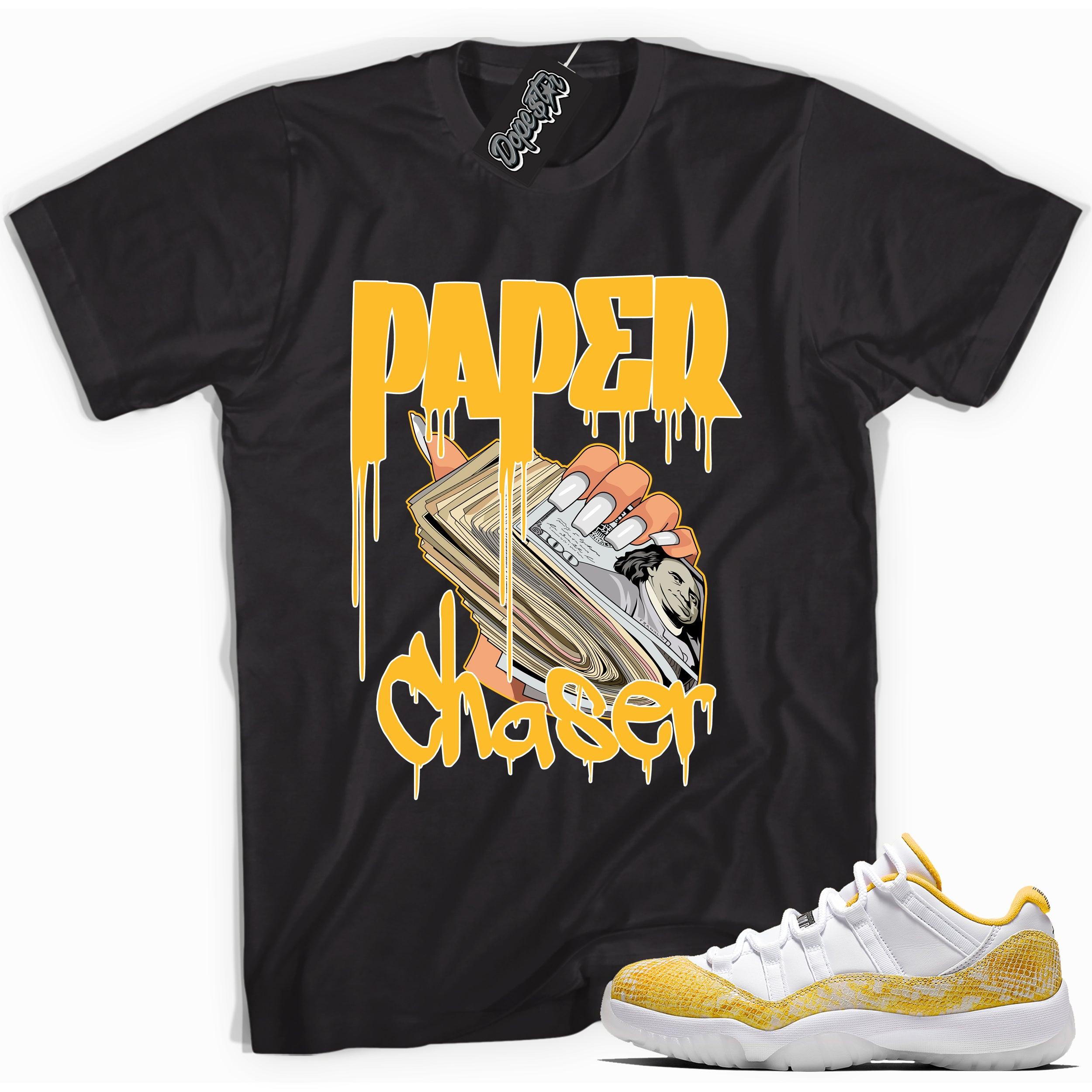 Cool black graphic tee with 'paper chaser' print, that perfectly matches Air Jordan 11 Retro Low Yellow Snakeskin sneakers