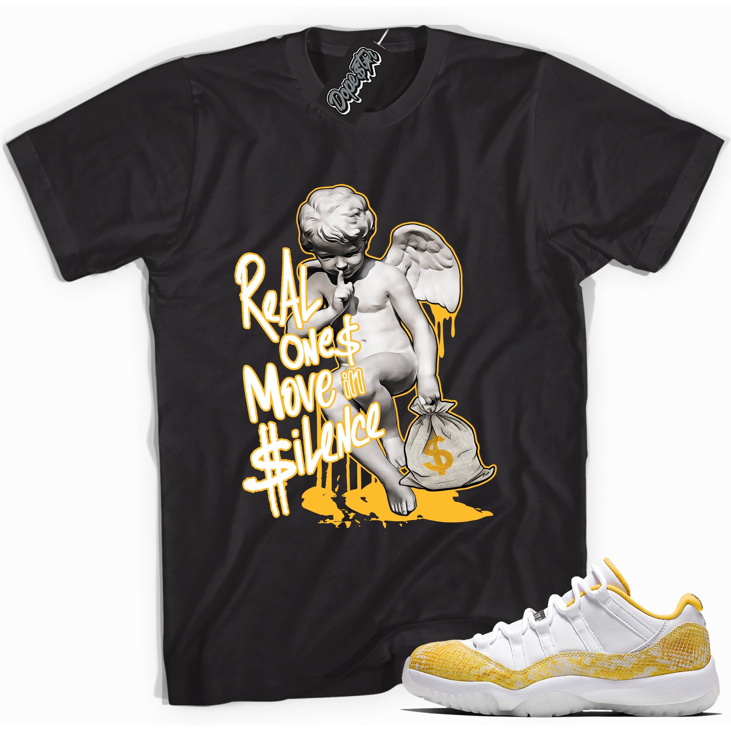 Cool black graphic tee with 'real ones move in silence' print, that perfectly matches Air Jordan 11 Retro Low Yellow Snakeskin sneakers