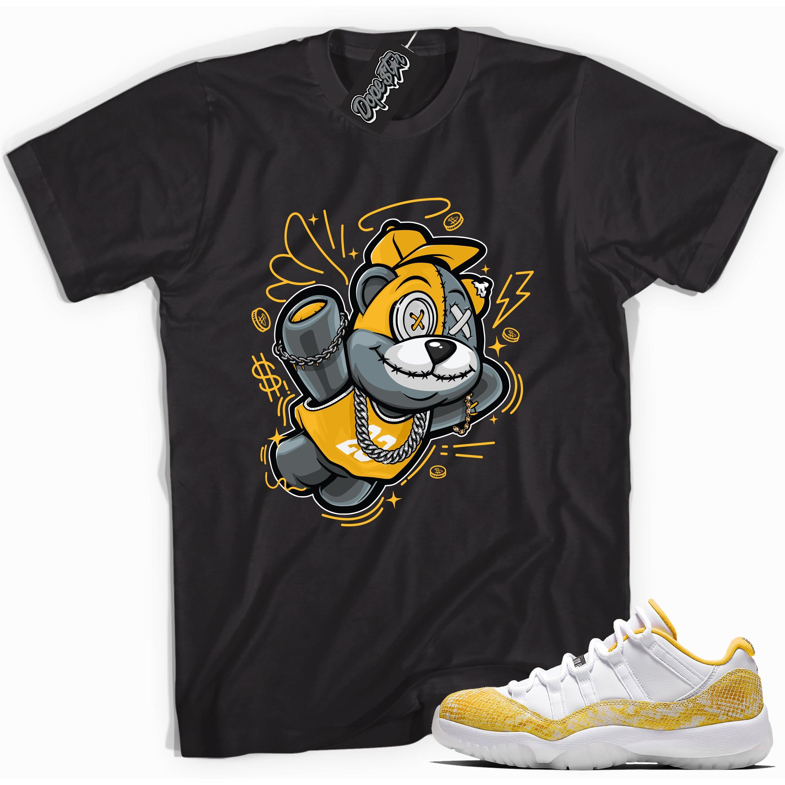 Cool black graphic tee with 'slam dunk bear' print, that perfectly matches Air Jordan 11 Retro Low Yellow Snakeskin sneakers