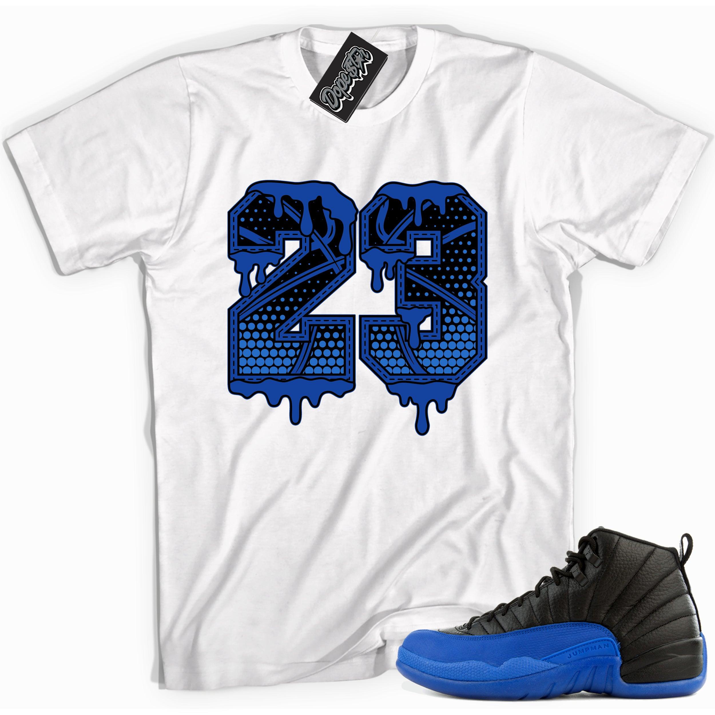 Cool white graphic tee with '23 basketball' print, that perfectly matches Air Jordan 12 Retro Black Game Royal sneakers.
