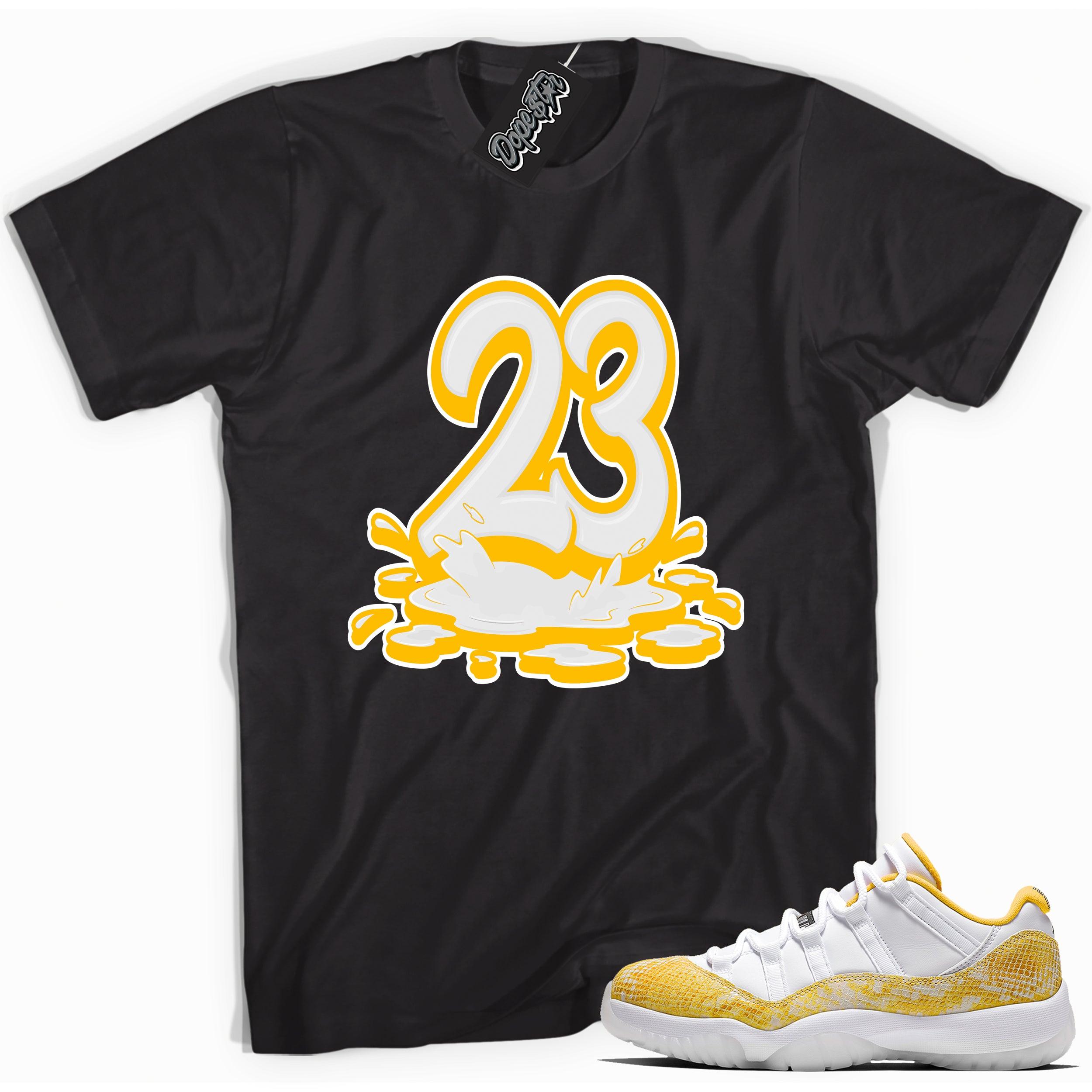 Cool black graphic tee with '23 melting' print, that perfectly matches  Air Jordan 11 Low Yellow Snakeskin sneakers