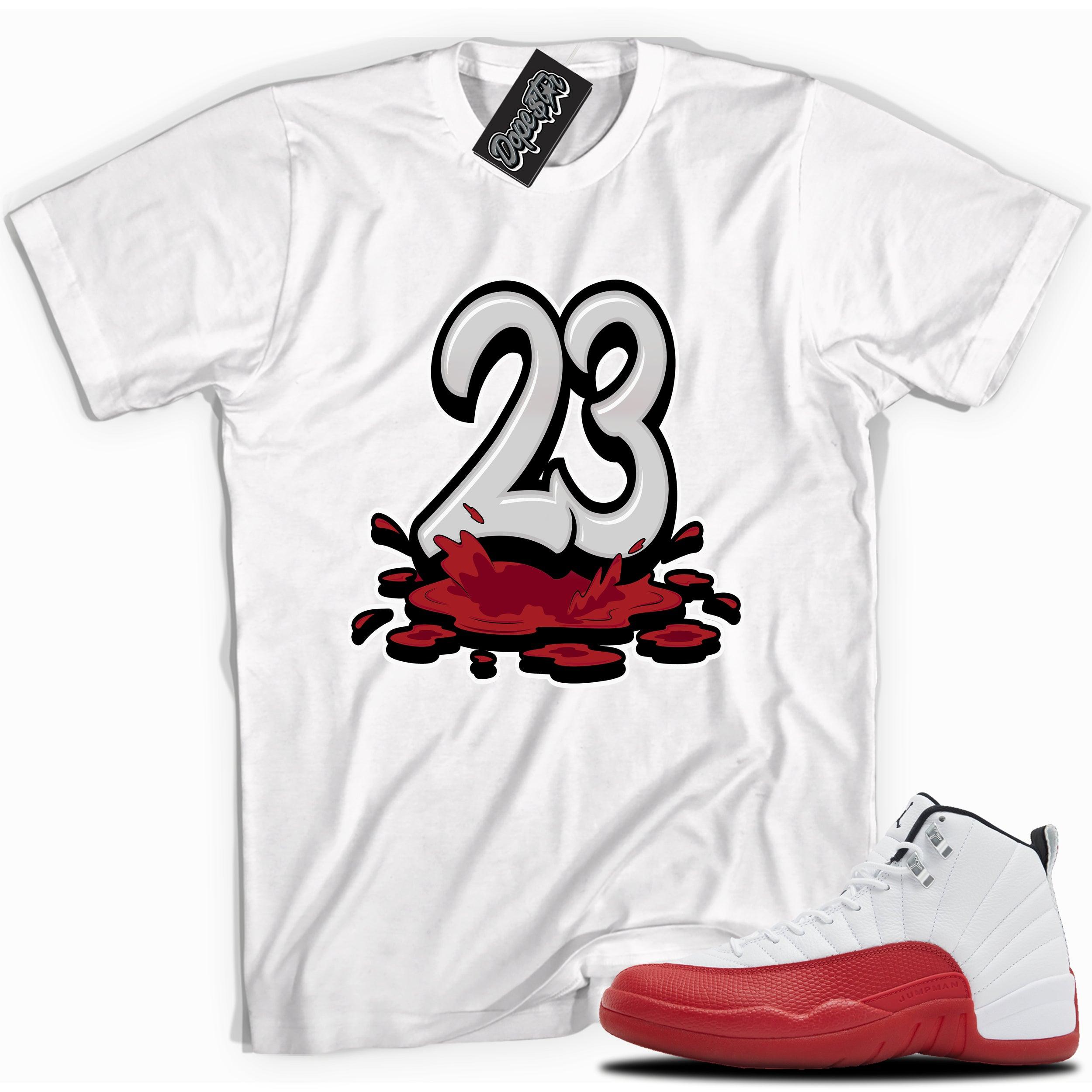 Cool White graphic tee with “ 23 Melting ” print, that perfectly matches Air Jordan 12 Retro Cherry Red 2023 red and white sneakers 