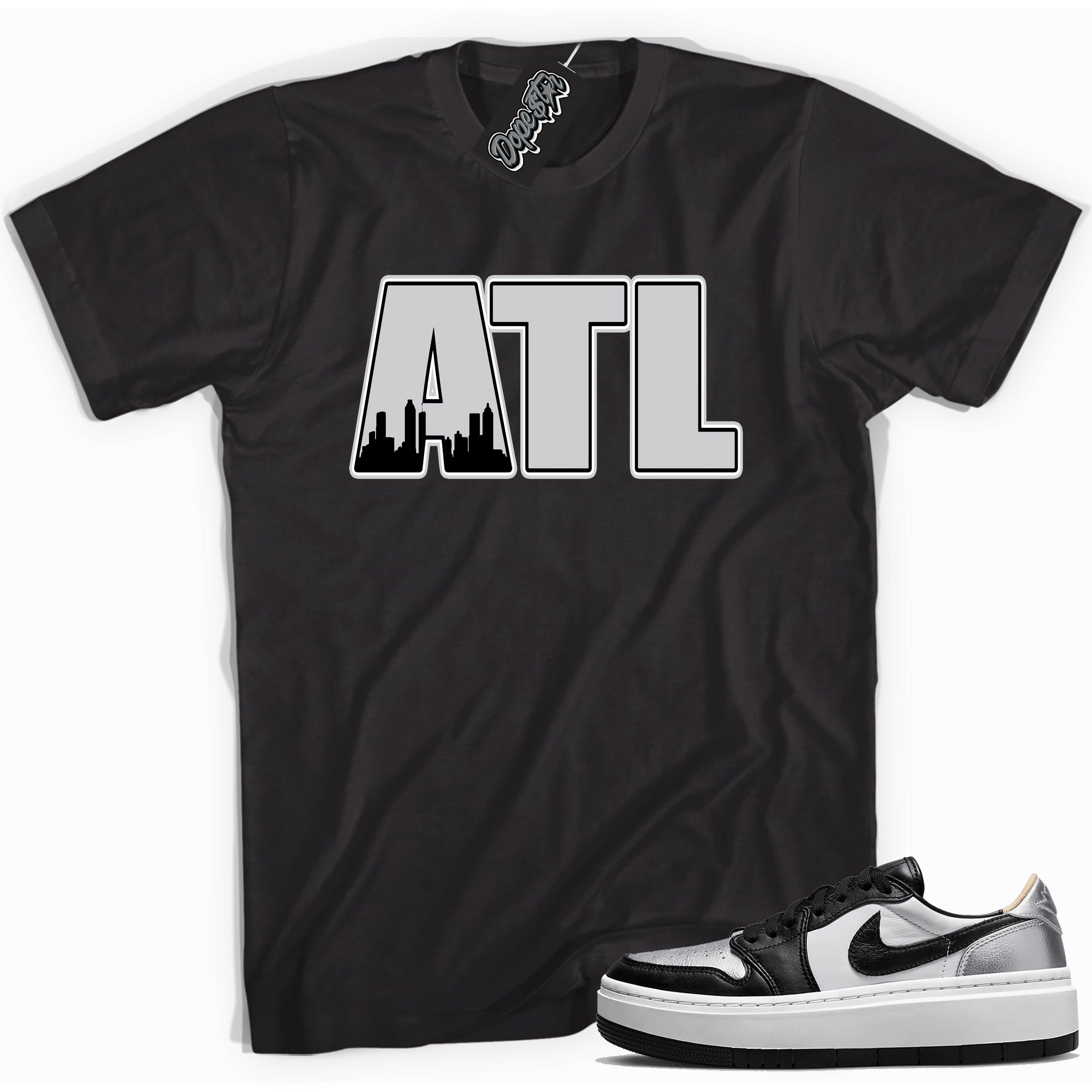 Cool black graphic tee with 'ATL Atlanta' print, that perfectly matches Air Jordan 1 Elevate Low SE Silver Toe sneakers.