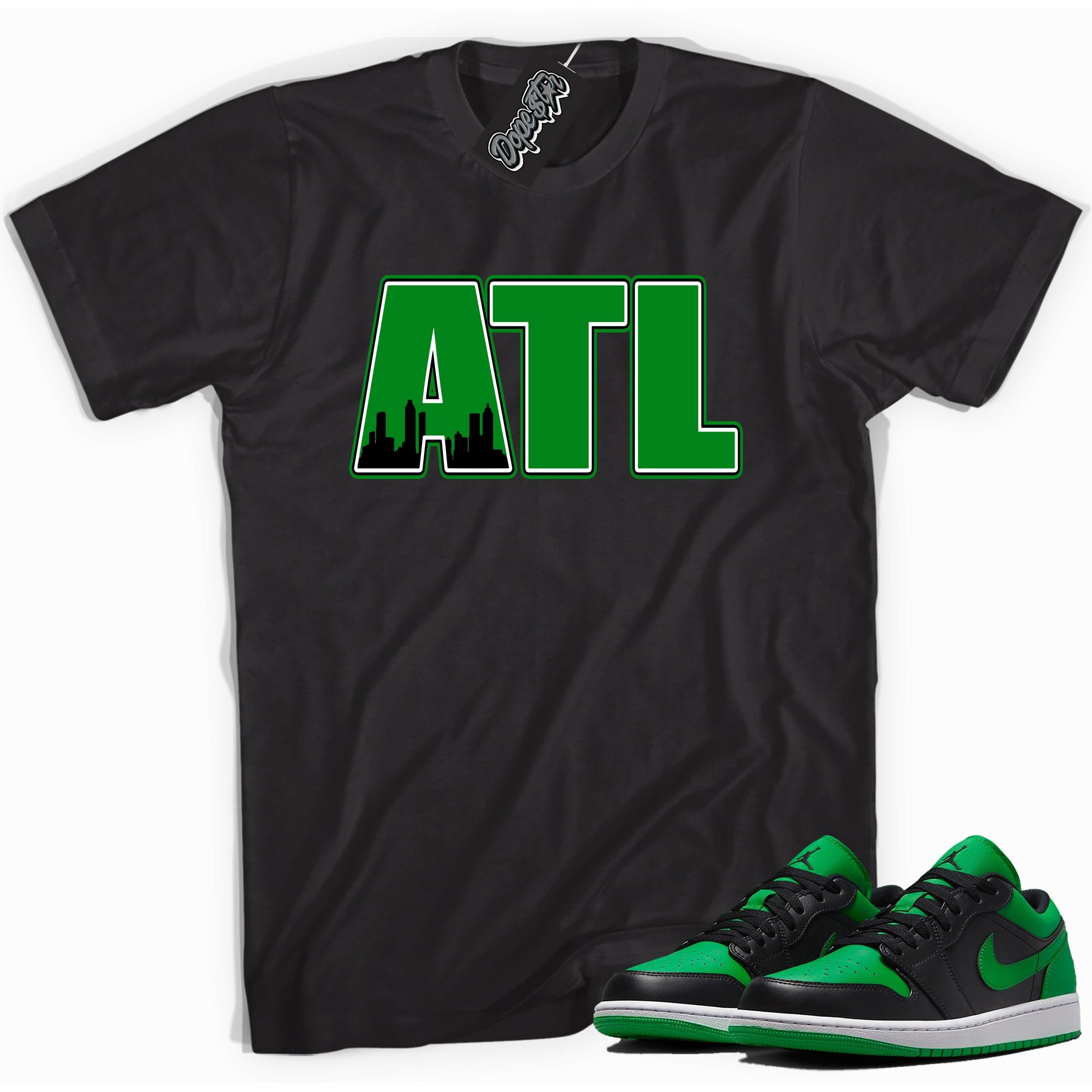 Cool black graphic tee with 'ATL' print, that perfectly matches Air Jordan 1 Low Lucky Green sneakers