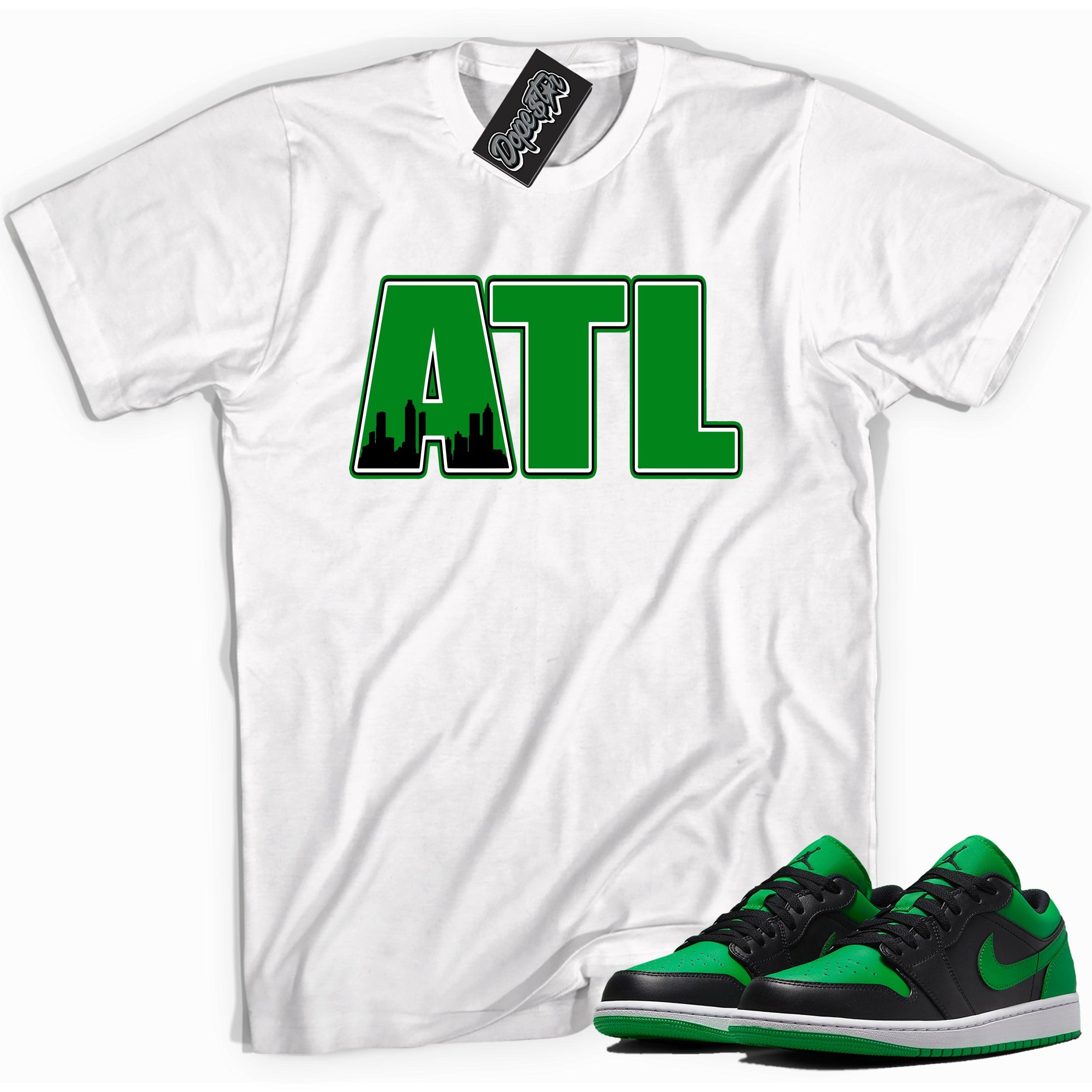 Cool white graphic tee with 'ATL' print, that perfectly matches Air Jordan 1 Low Lucky Green sneakers
