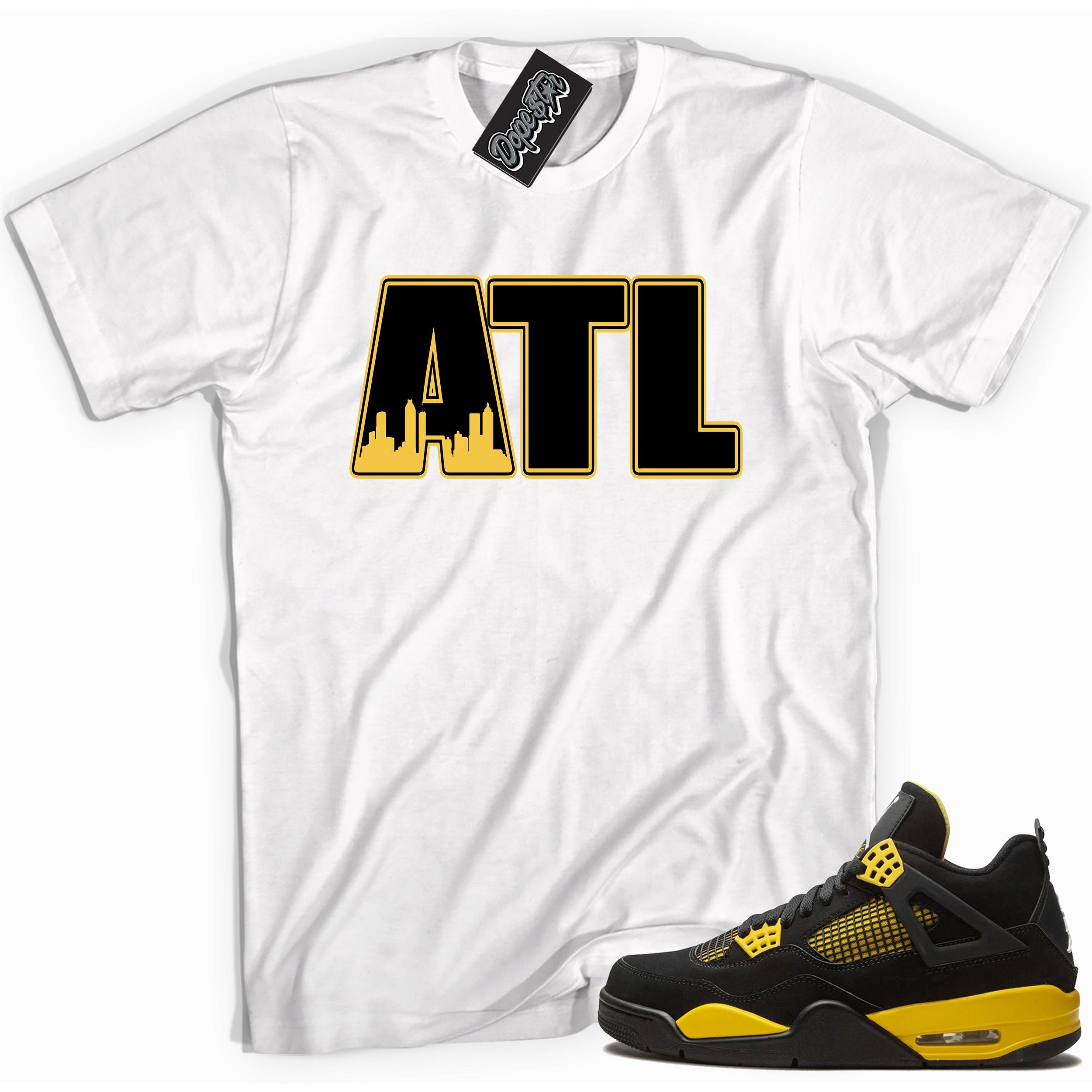 Cool white graphic tee with 'ATL Atlanta' print, that perfectly matches Air Jordan 4 Thunder sneakers