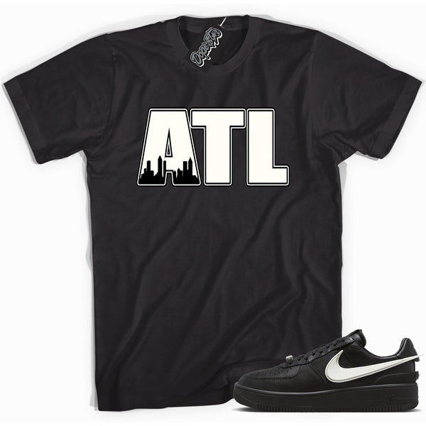 Cool black graphic tee with 'Atlanta ATL' print, that perfectly matches Nike Air Force 1 Low SP Ambush Phantom sneakers.