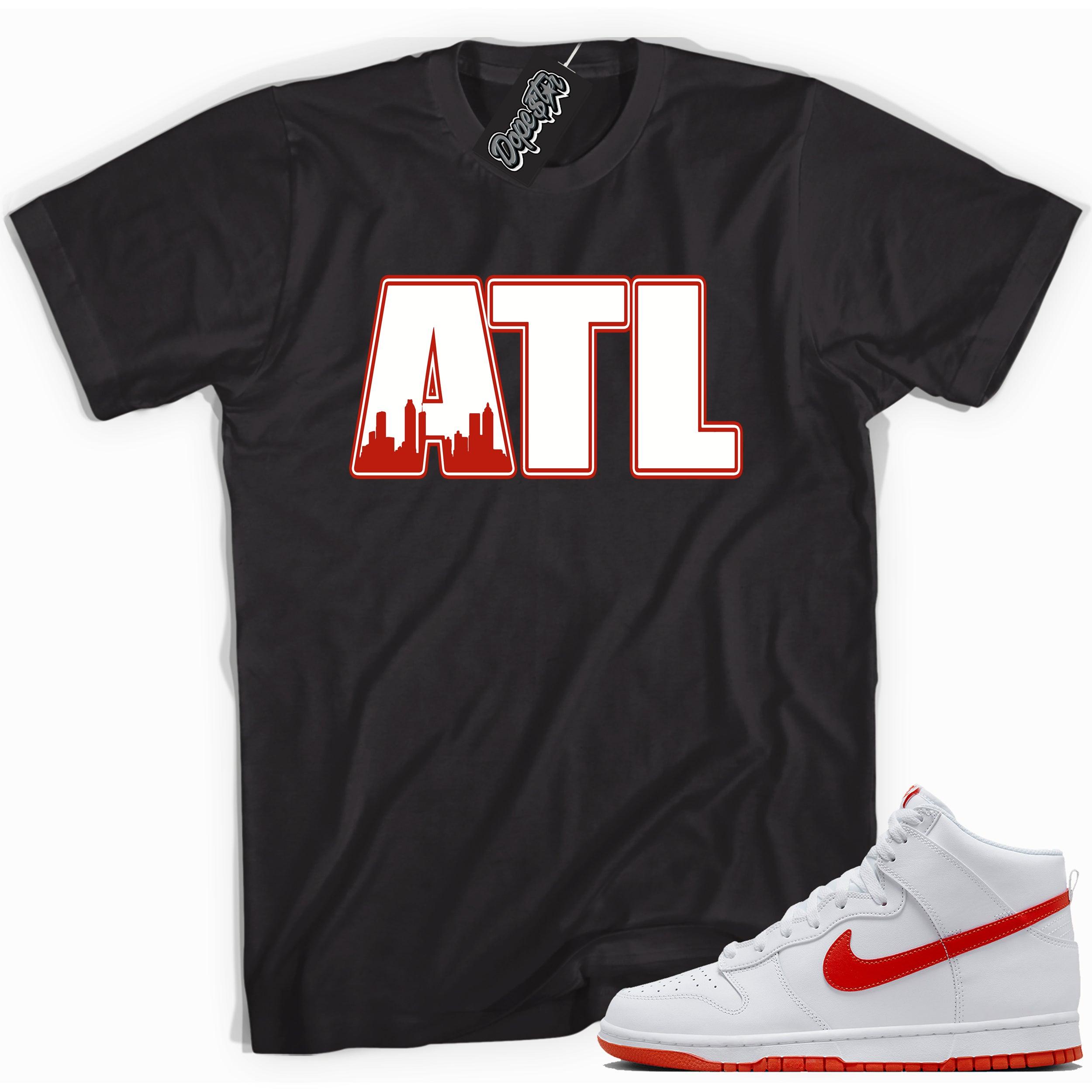 Cool black graphic tee with 'atl atlanta' print, that perfectly matches Nike Dunk High White Picante Red sneakers.
