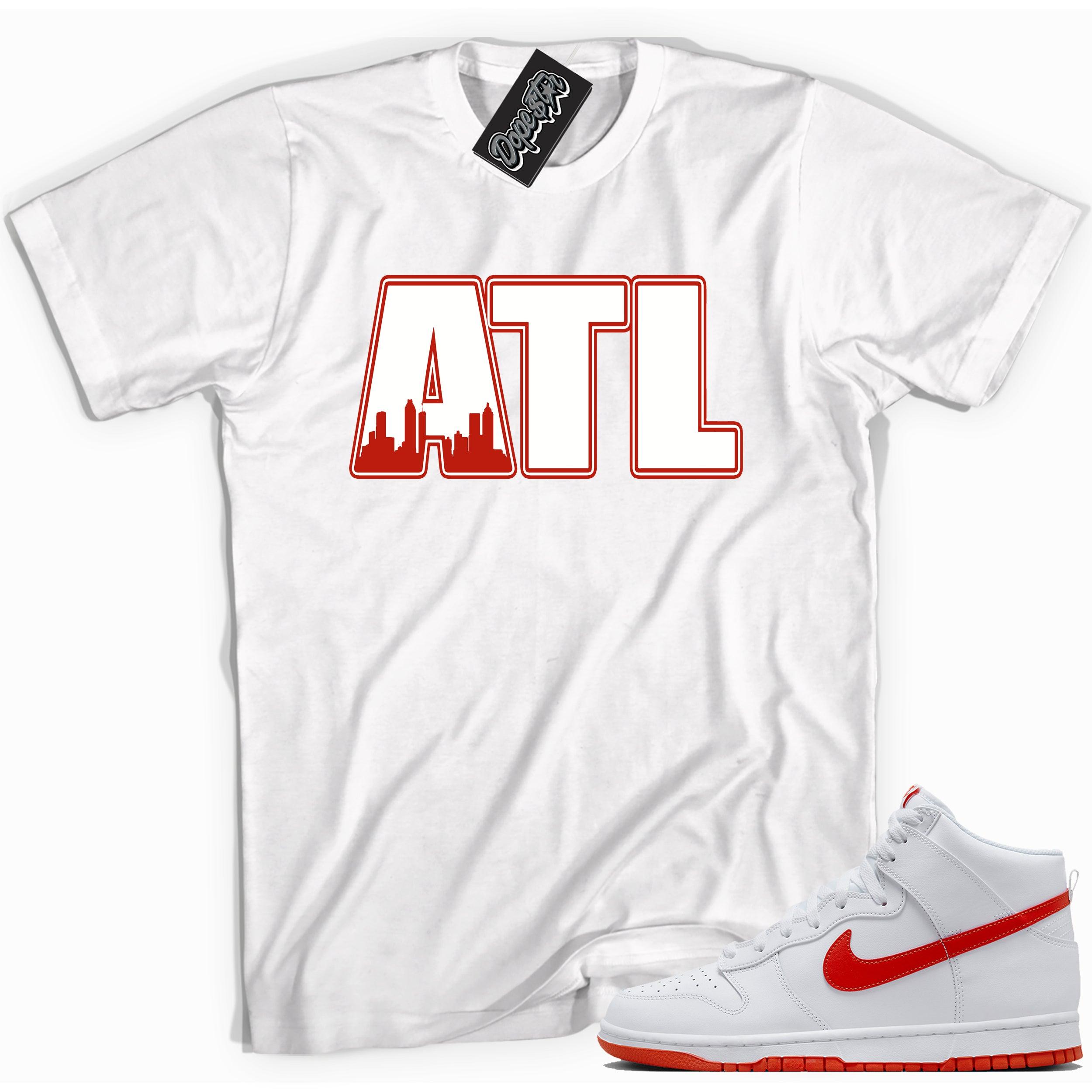 Cool white graphic tee with 'atl atlanta' print, that perfectly matches Nike Dunk High White Picante Red sneakers.
