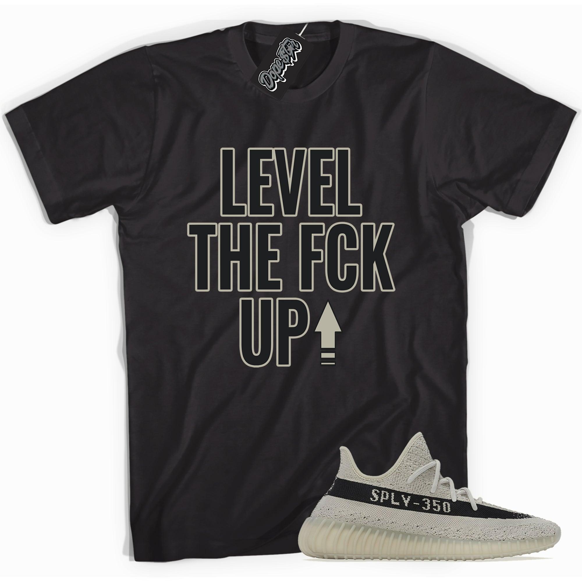 Cool black graphic tee with 'Level Up' print, that perfectly matches Adidas Yeezy Boost 350 V2 Slate sneakers.
