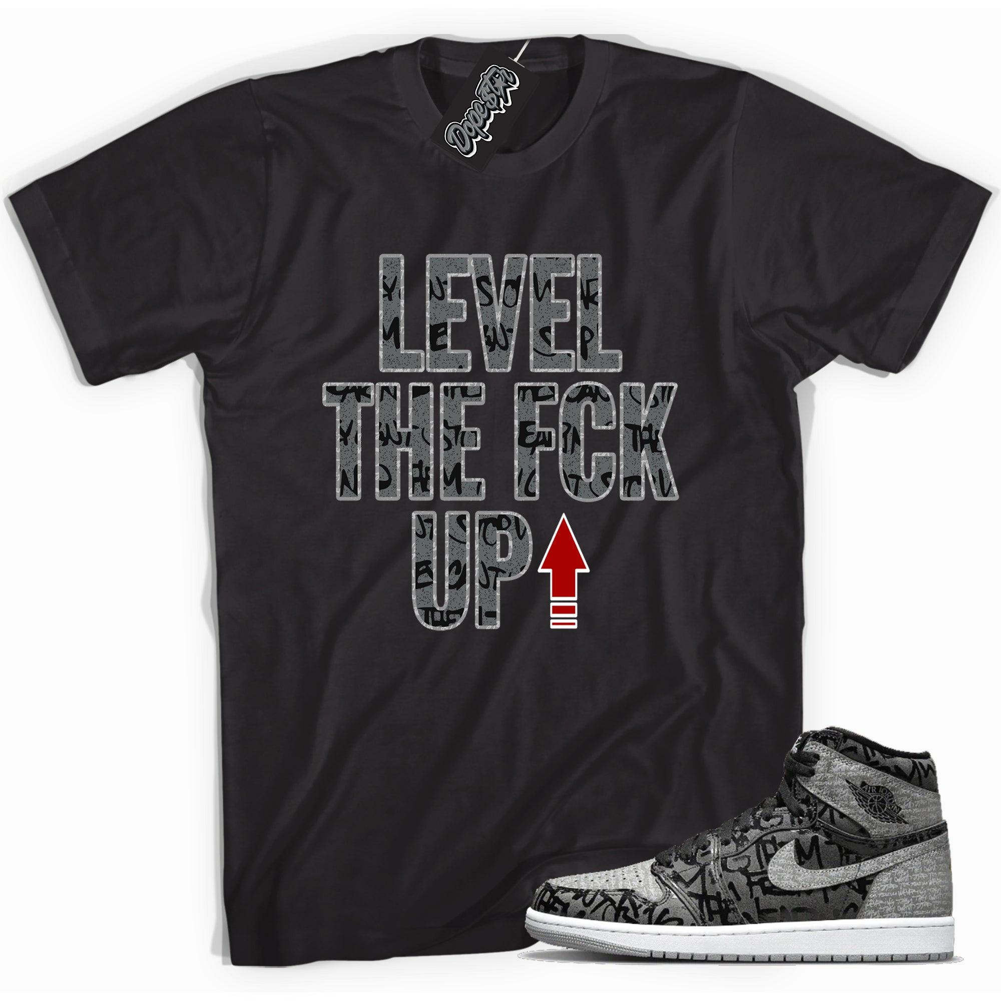 Cool black graphic tee with 'level up' print, that perfectly matches Air Jordan 1 High OG Rebellionaire sneakers.