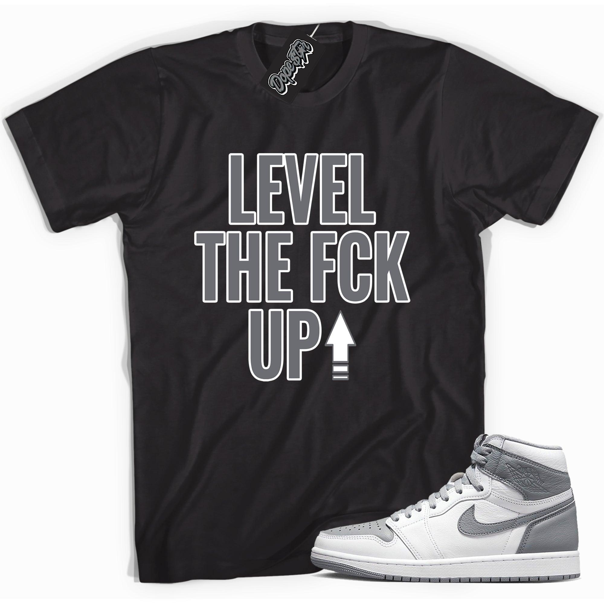 Cool black graphic tee with 'Level Up' print, that perfectly matches Air Jordan 1 High OG Stealth sneakers.