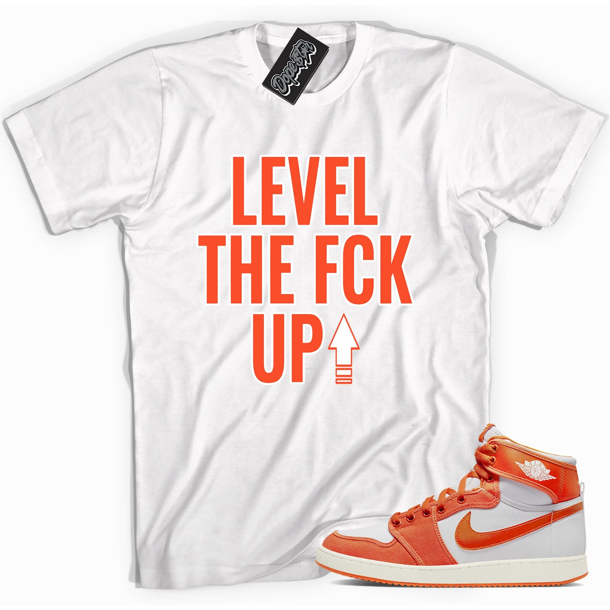 Cool white graphic tee with 'Level Up' print, that perfectly matches Air Jordan 1 KO syracuse sneakers.