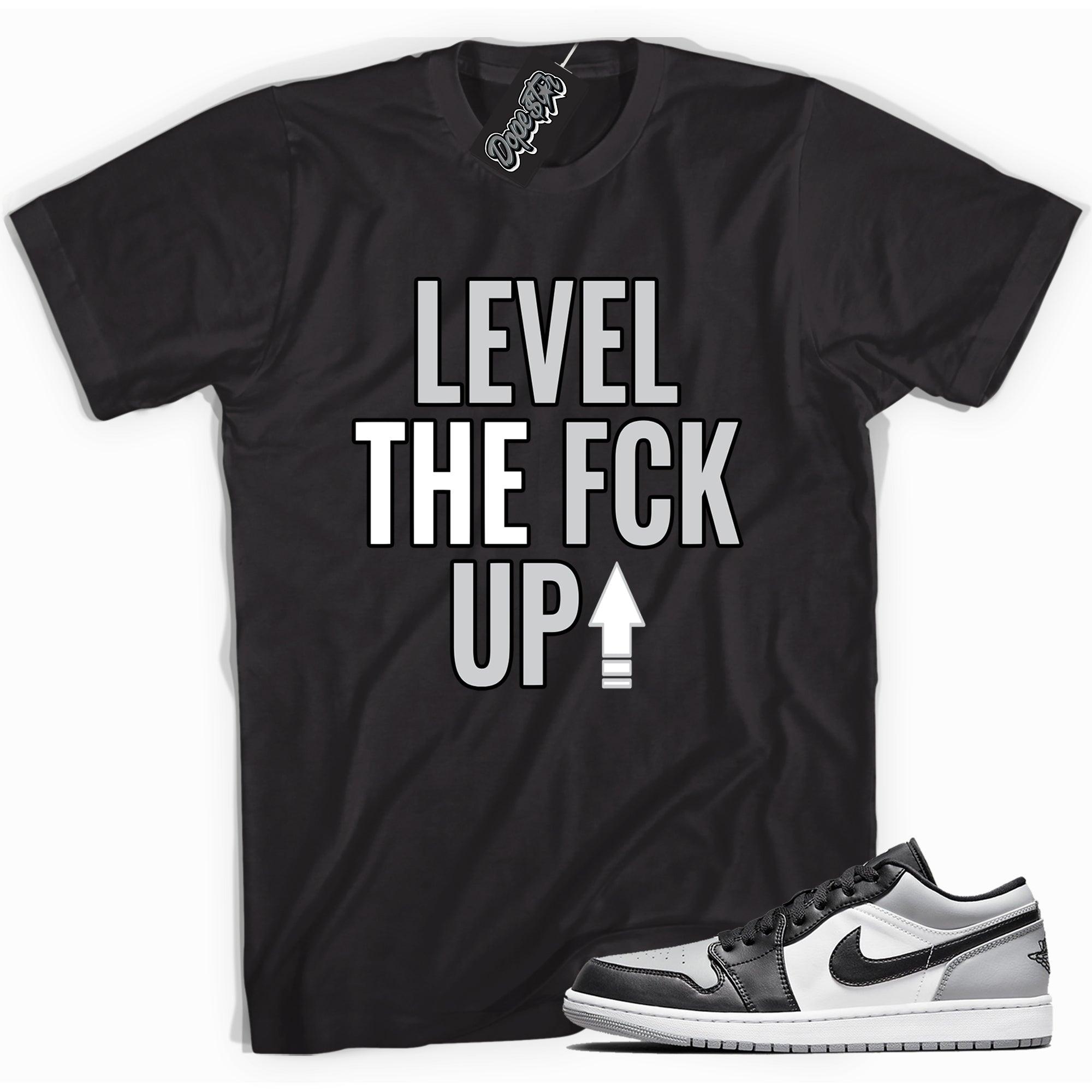 Cool black graphic tee with 'Level Up' print, that perfectly matches Air Jordan 1 Low Shadow Toe sneakers.
