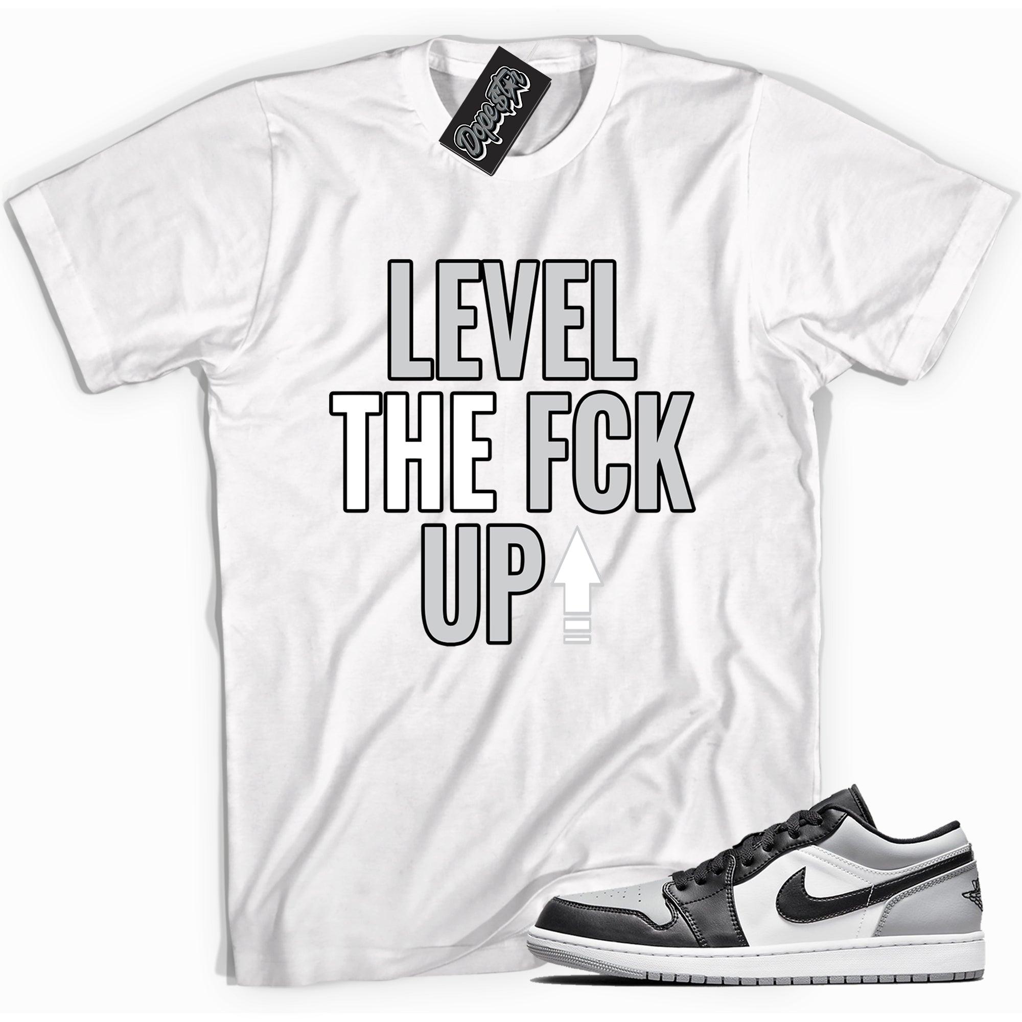 Cool white graphic tee with 'Level Up' print, that perfectly matches Air Jordan 1 Low Shadow Toe sneakers.