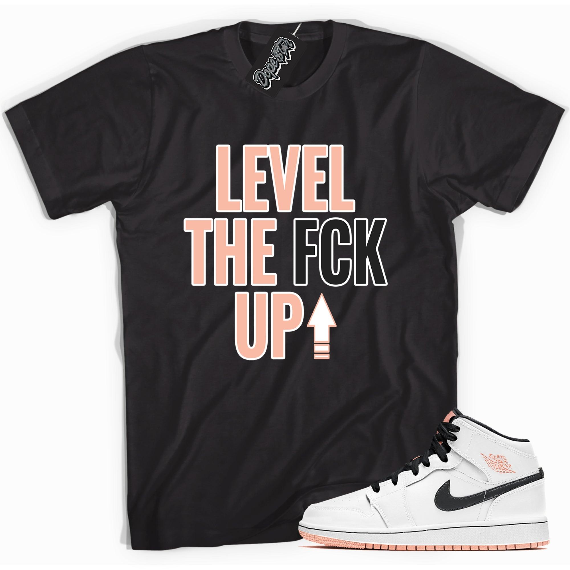 Cool black graphic tee with 'Level Up' print, that perfectly matches Air Jordan 1 Mid Arctic Orange sneakers.