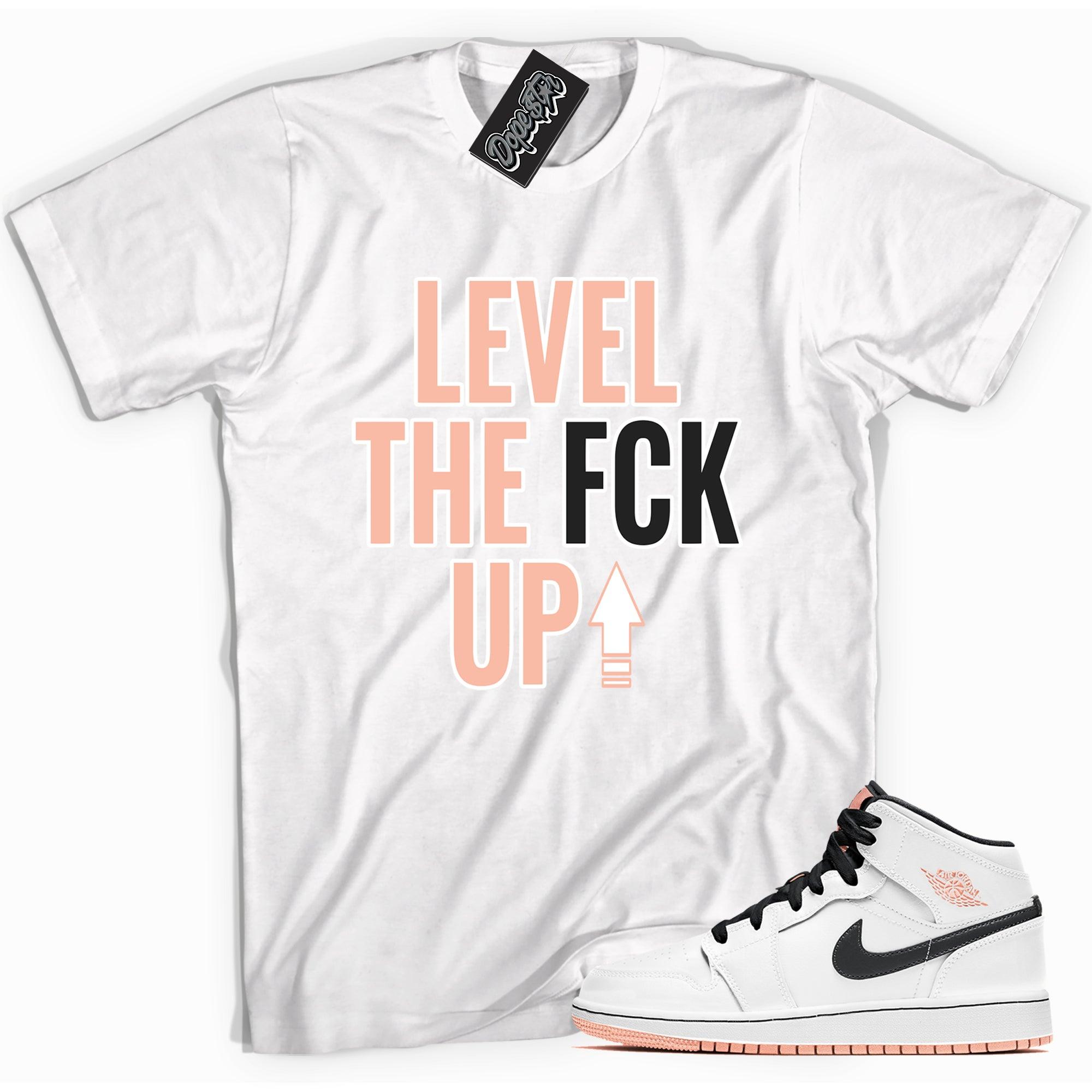 Cool white graphic tee with 'Level Up' print, that perfectly matches Air Jordan 1 Mid Arctic Orange sneakers.