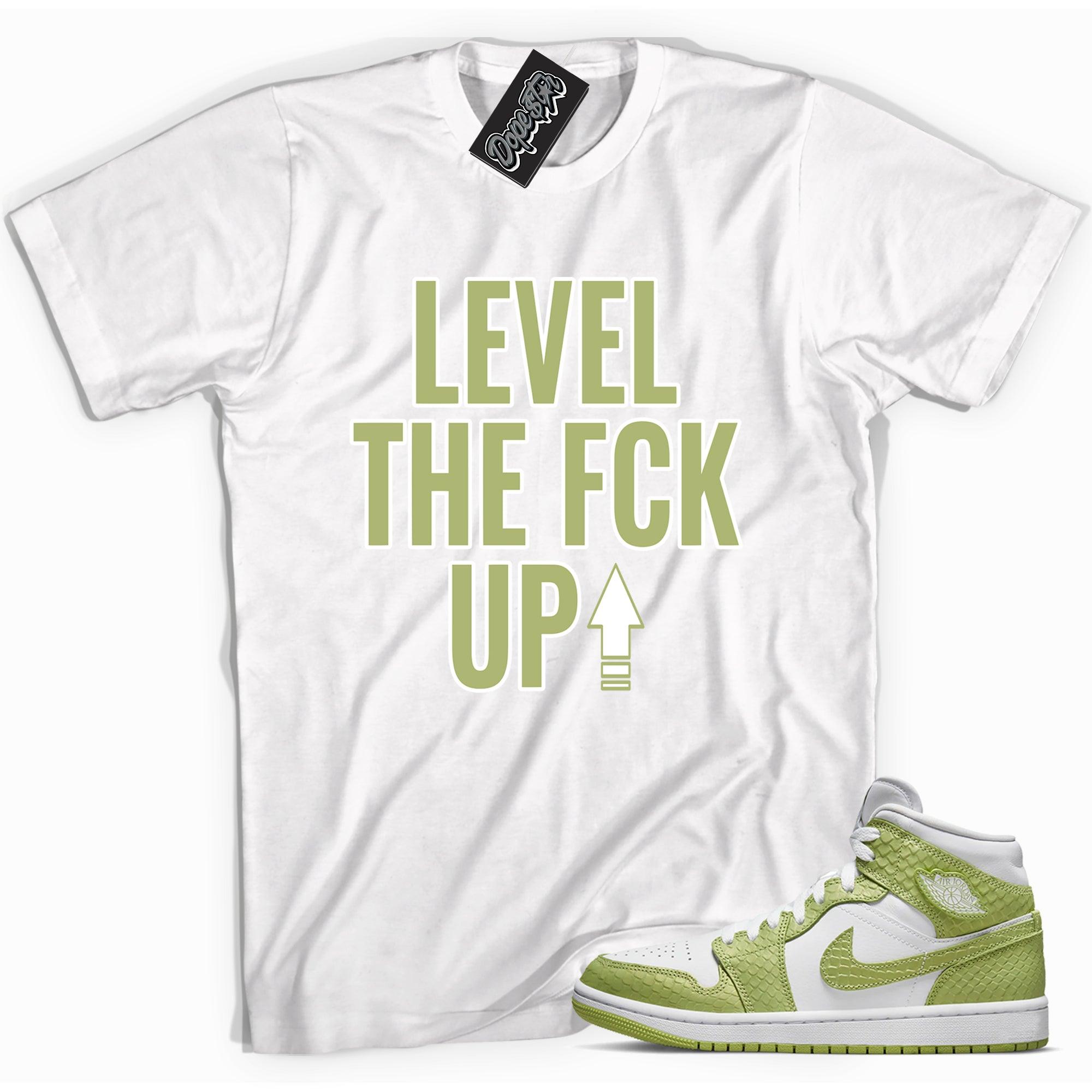 Cool white graphic tee with 'Level Up' print, that perfectly matches Air Jordan 1 Mid Green Python sneakers.