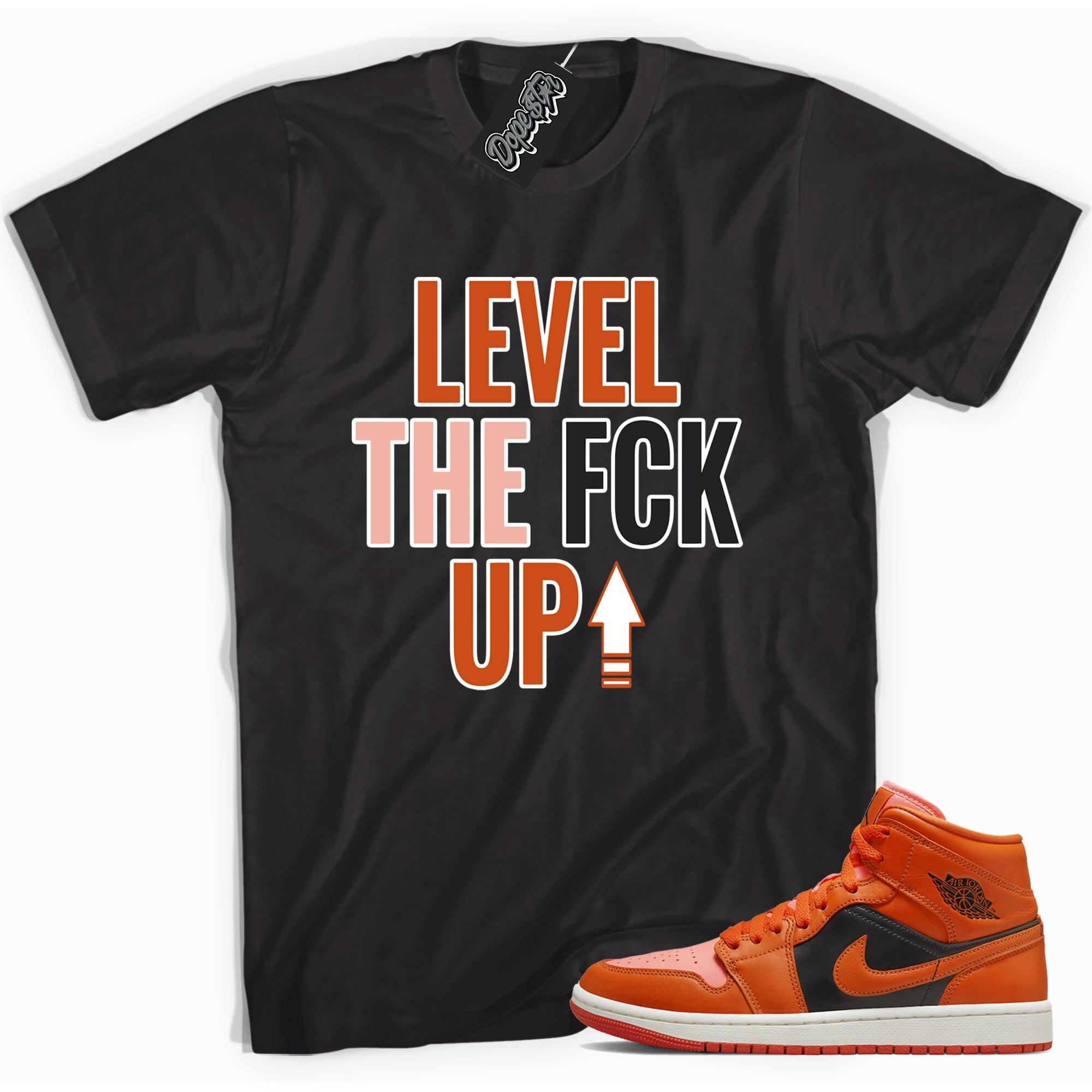 Cool black graphic tee with 'Level Up' print, that perfectly matches Air Jordan 1 Mid Orange Black sneakers.