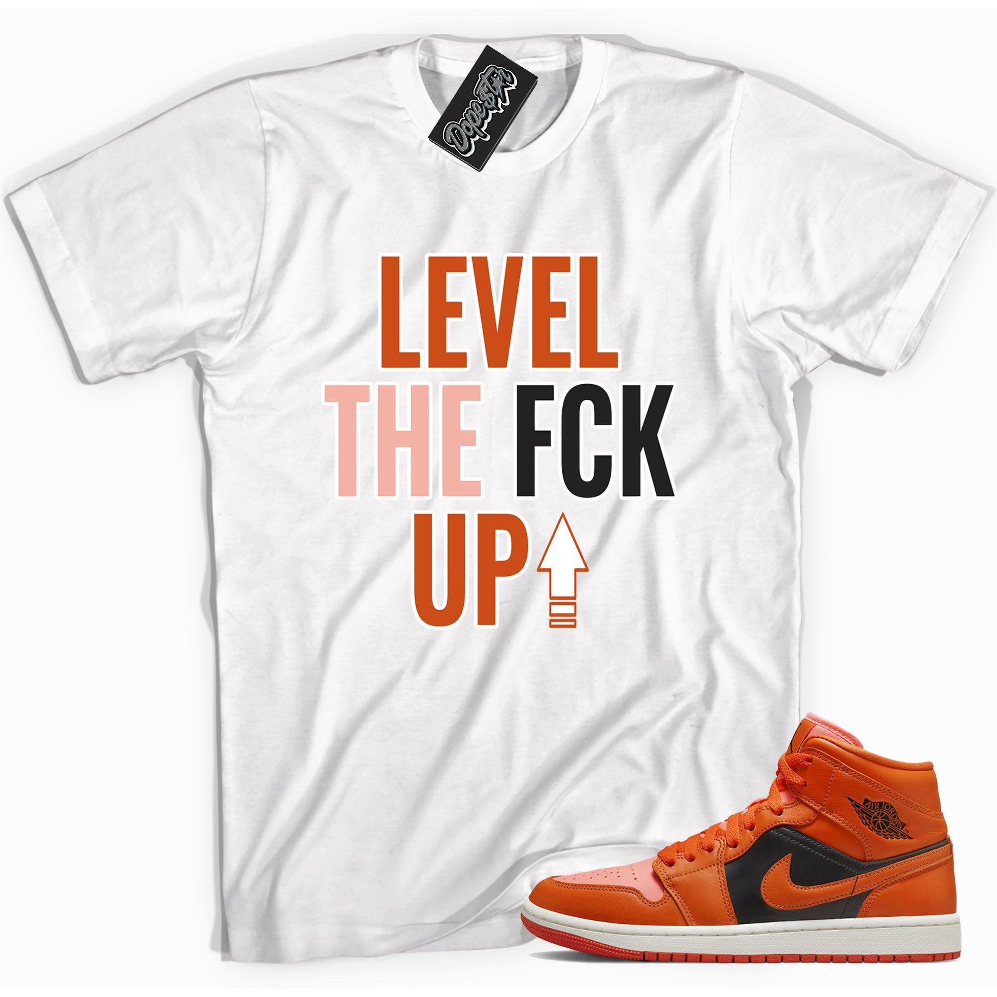 Cool white graphic tee with 'Level Up' print, that perfectly matches Air Jordan 1 Mid Orange Black sneakers.