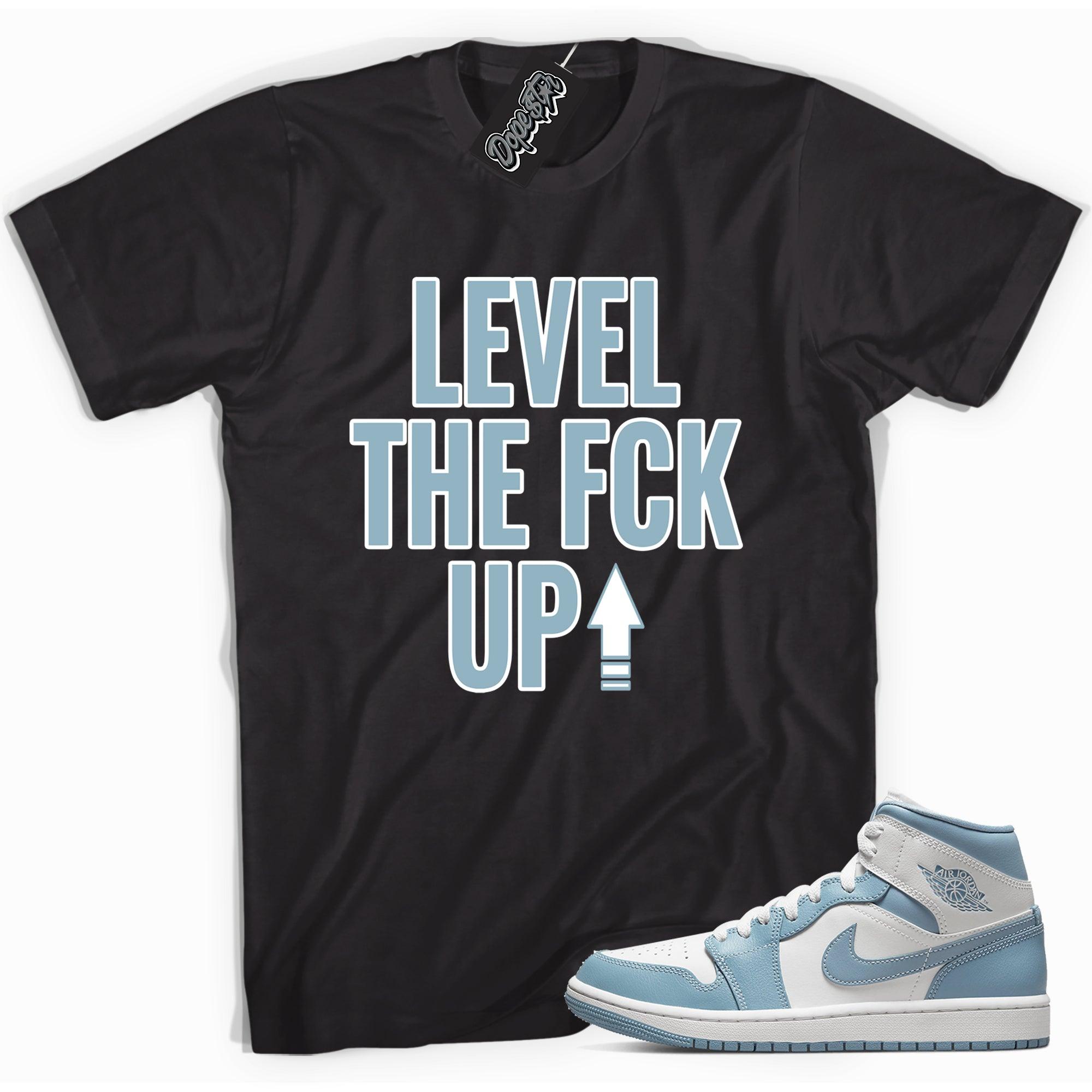 Cool black graphic tee with 'Level Up' print, that perfectly matches Air Jordan 1 Mid UNC sneakers.
