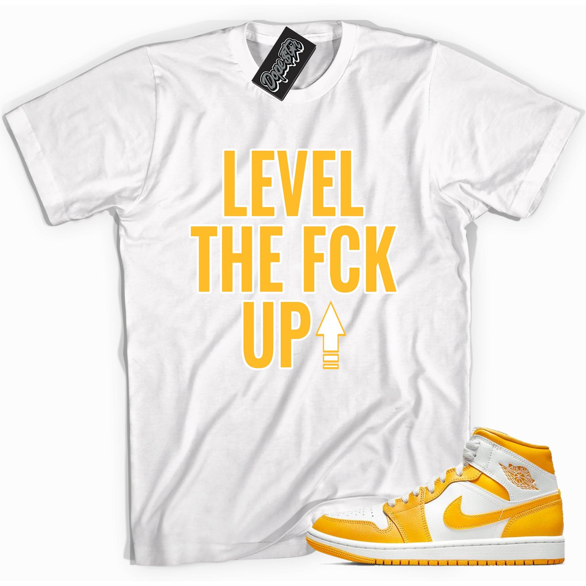 Cool white graphic tee with 'Level Up' print, that perfectly matches Air Jordan 1 Mid White University Gold sneakers.