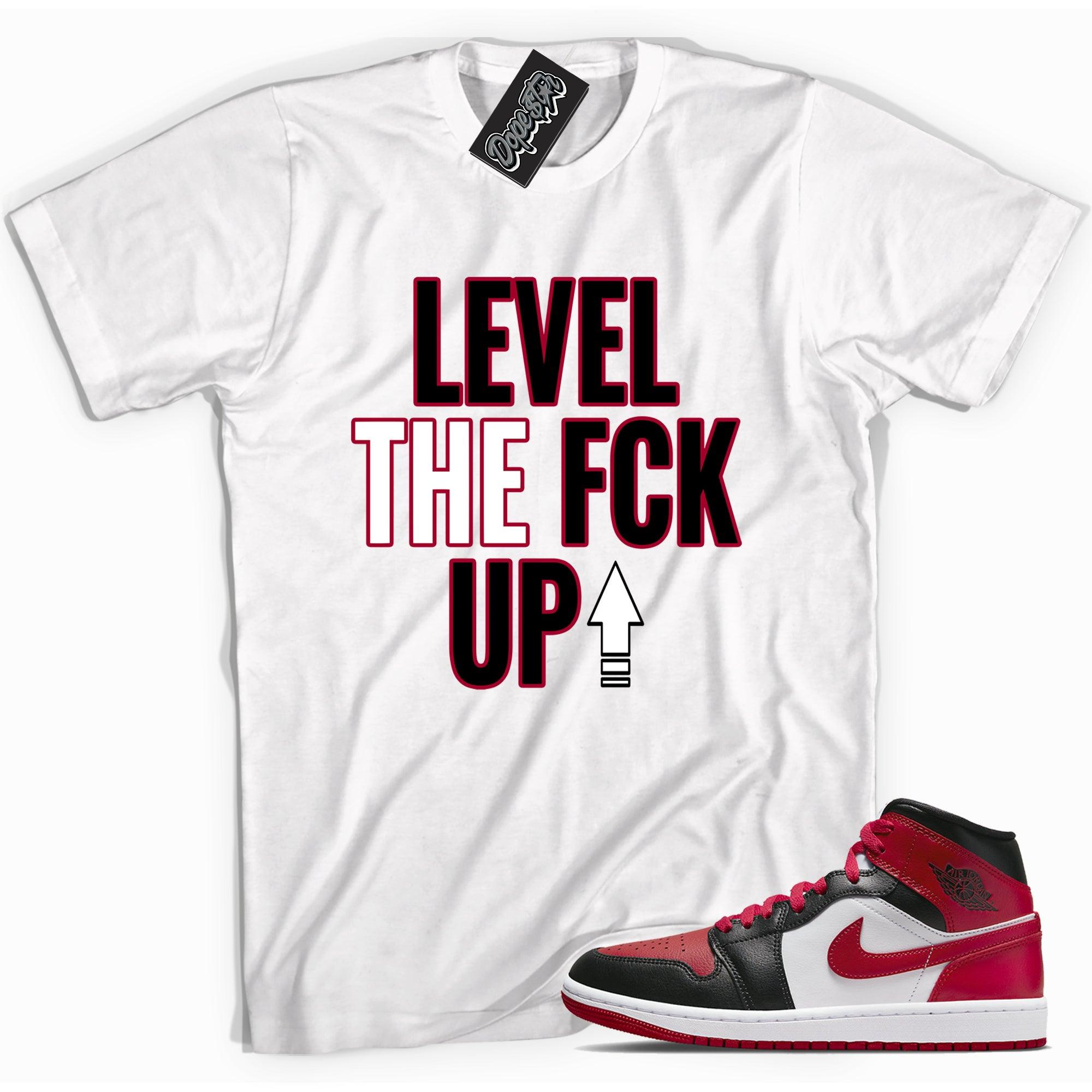 Cool white graphic tee with 'Level Up' print, that perfectly matches Air Jordan 1 Miid Alternate Bred Toe sneakers.
