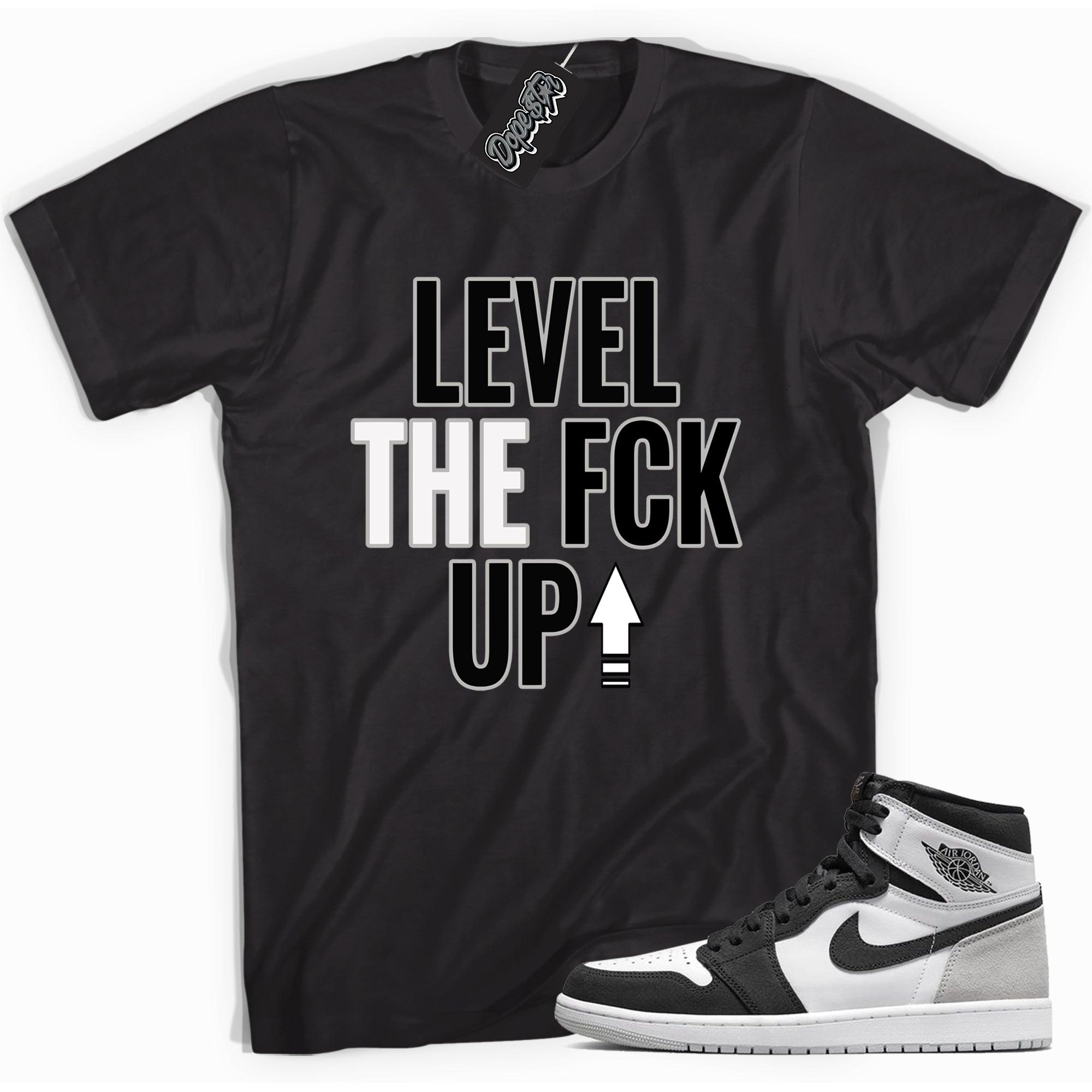 Cool black graphic tee with 'Level Up' print, that perfectly matches Air Jordan 1 Retro High OG Stage Haze sneakers.