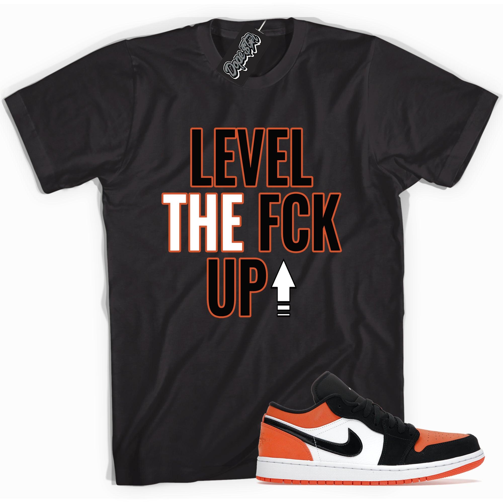 Cool black graphic tee with 'Level Up' print, that perfectly matches  Air Jordan 1 Retro Low GolF Shattered Backboard sneakers.