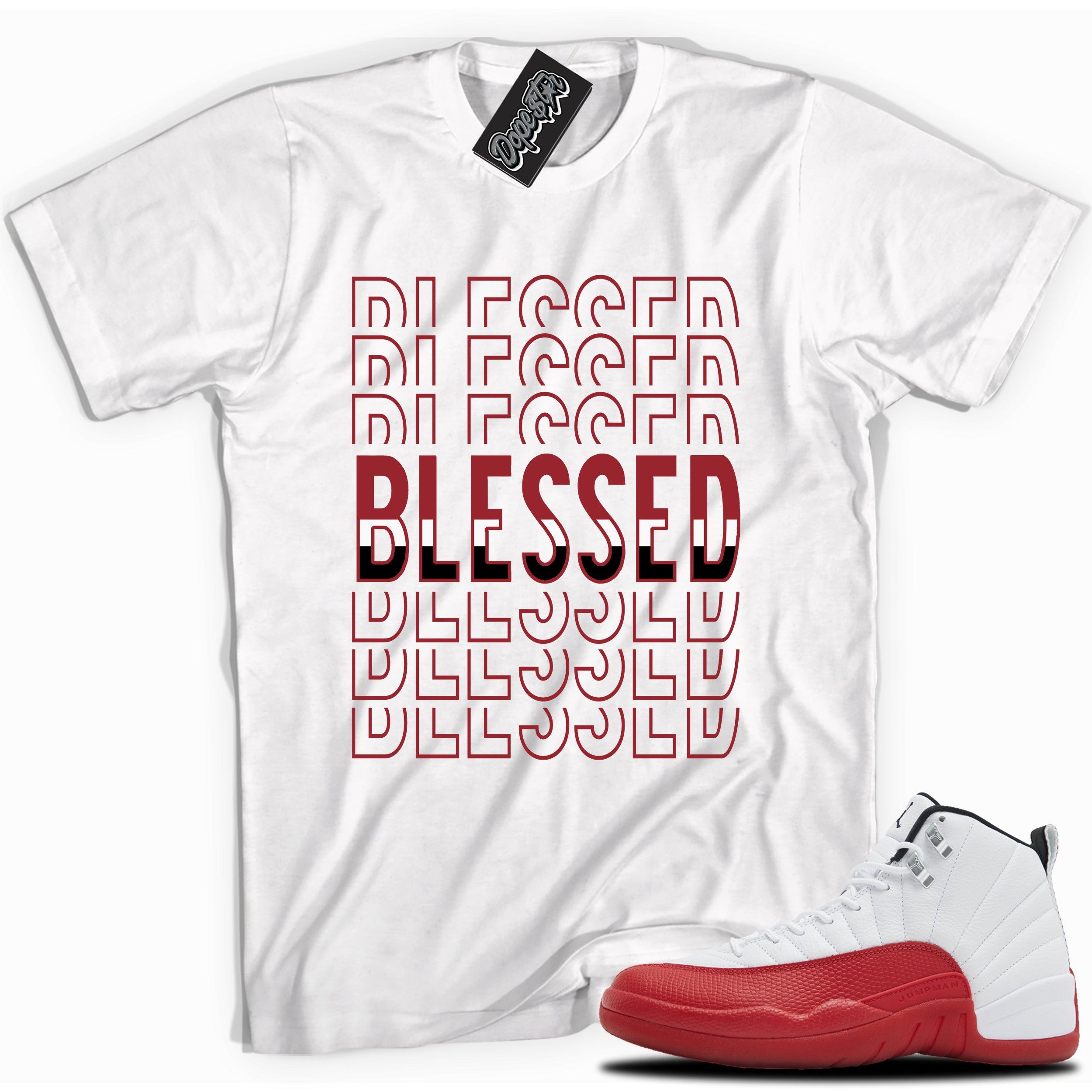 Cool White graphic tee with “ BLESSED STACKED ” print, that perfectly matches Air Jordan 12 Retro Cherry Red 2023 red and white sneakers
