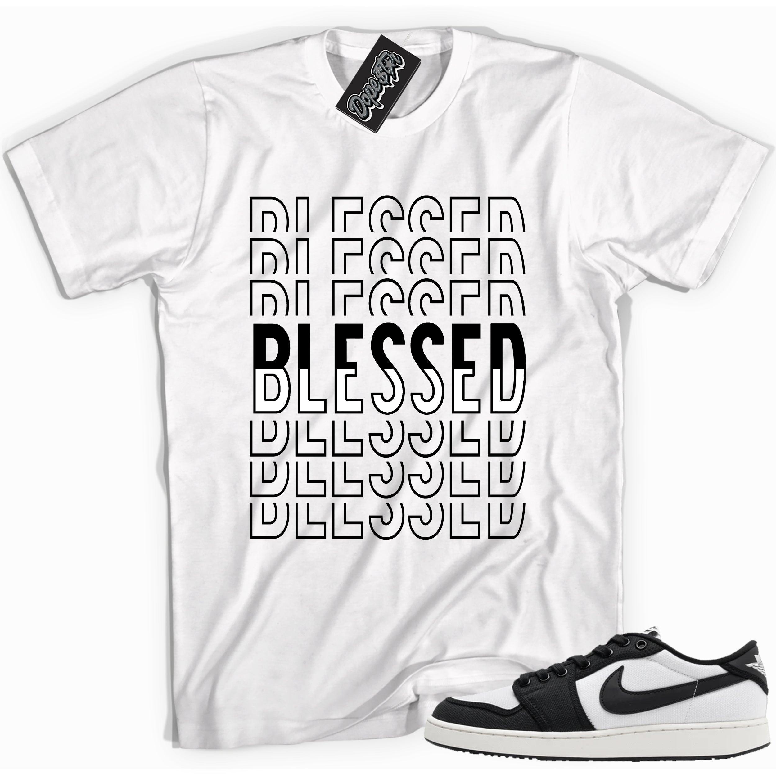 Cool white graphic tee with 'blessed' print, that perfectly matches Air Jordan 1 Retro Ajko Low Black & White sneakers.