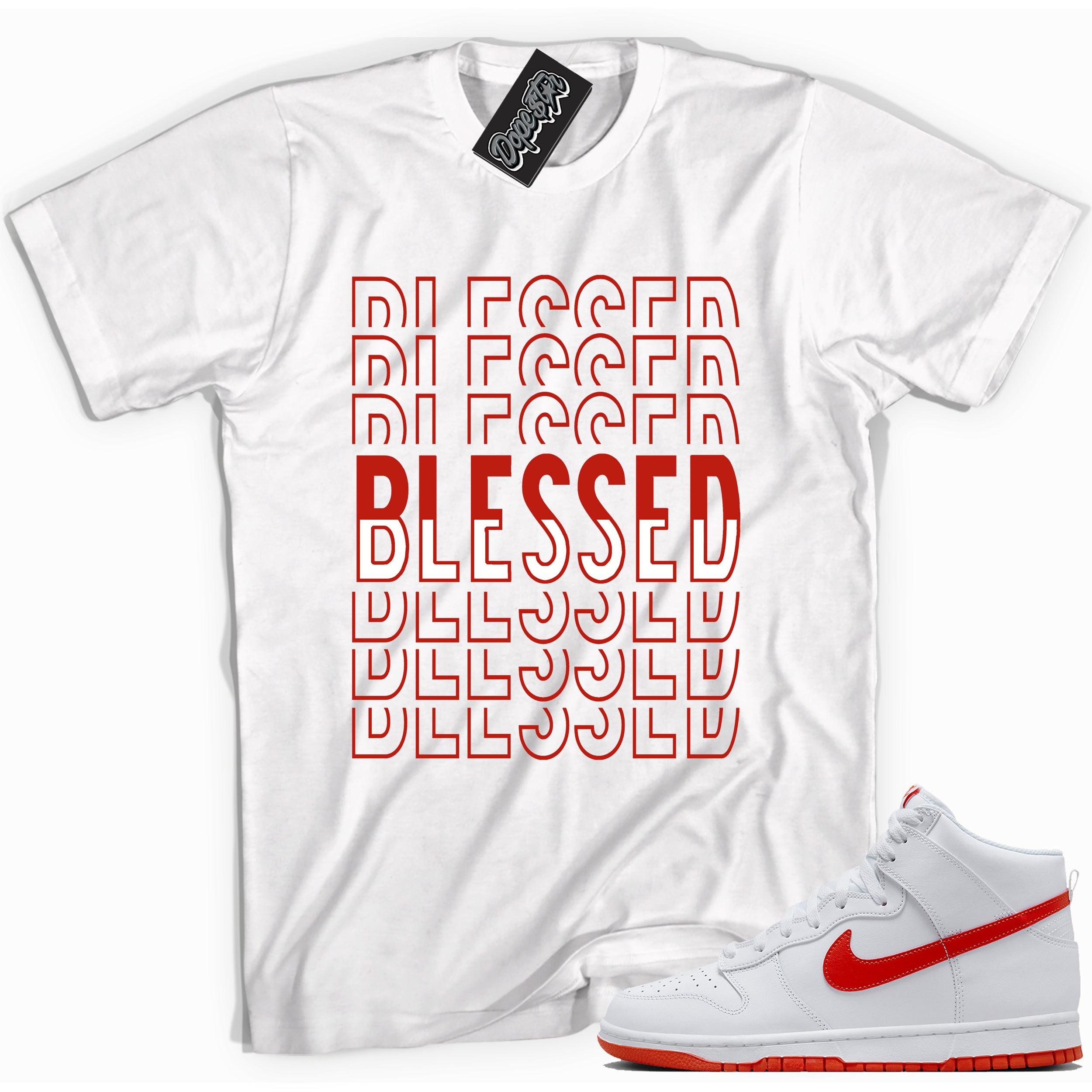 Cool white graphic tee with 'blessed' print, that perfectly matches Nike Dunk High White Picante Red sneakers.