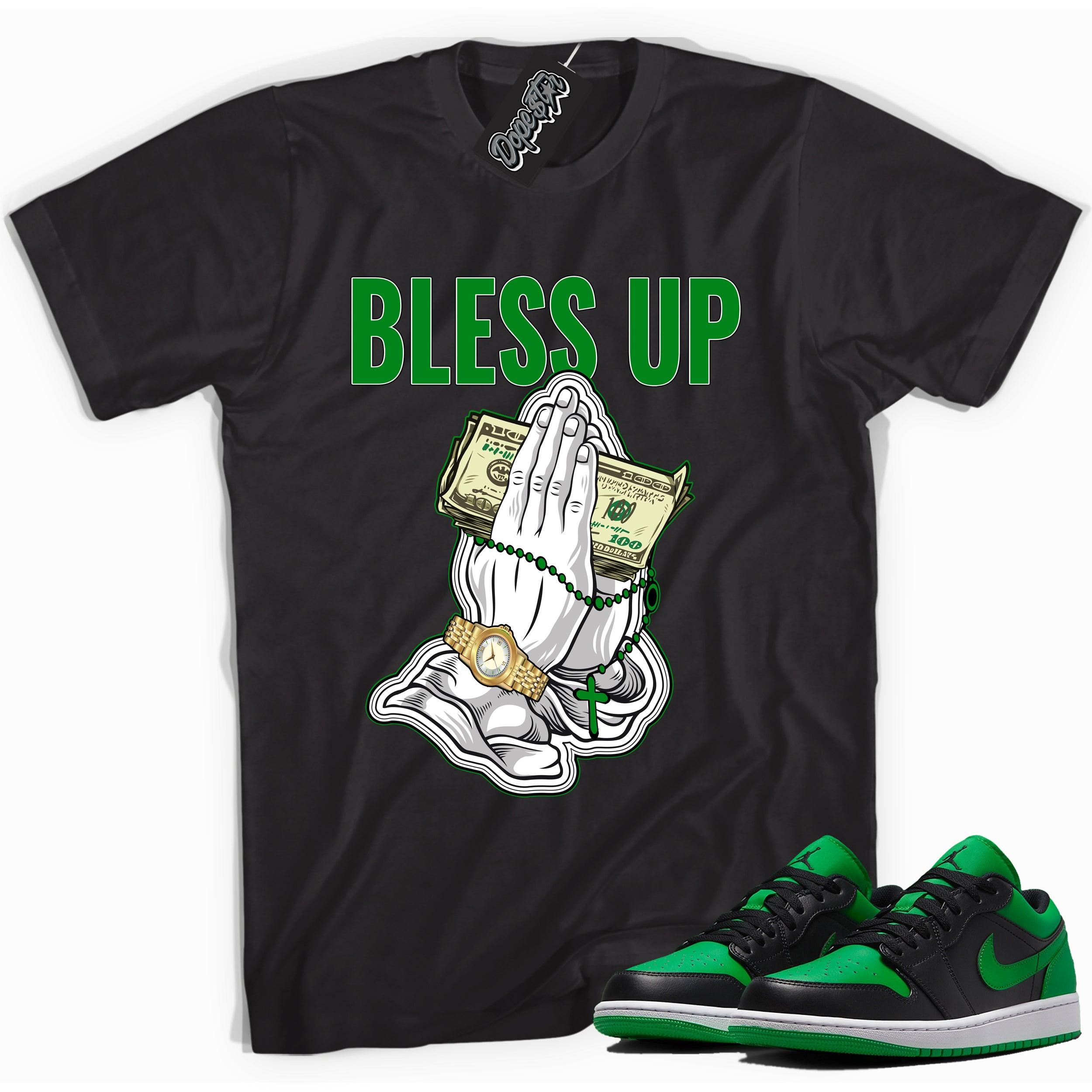 Cool black graphic tee with 'Bless Up' print, that perfectly matches Air Jordan 1 Low Lucky Green sneakers