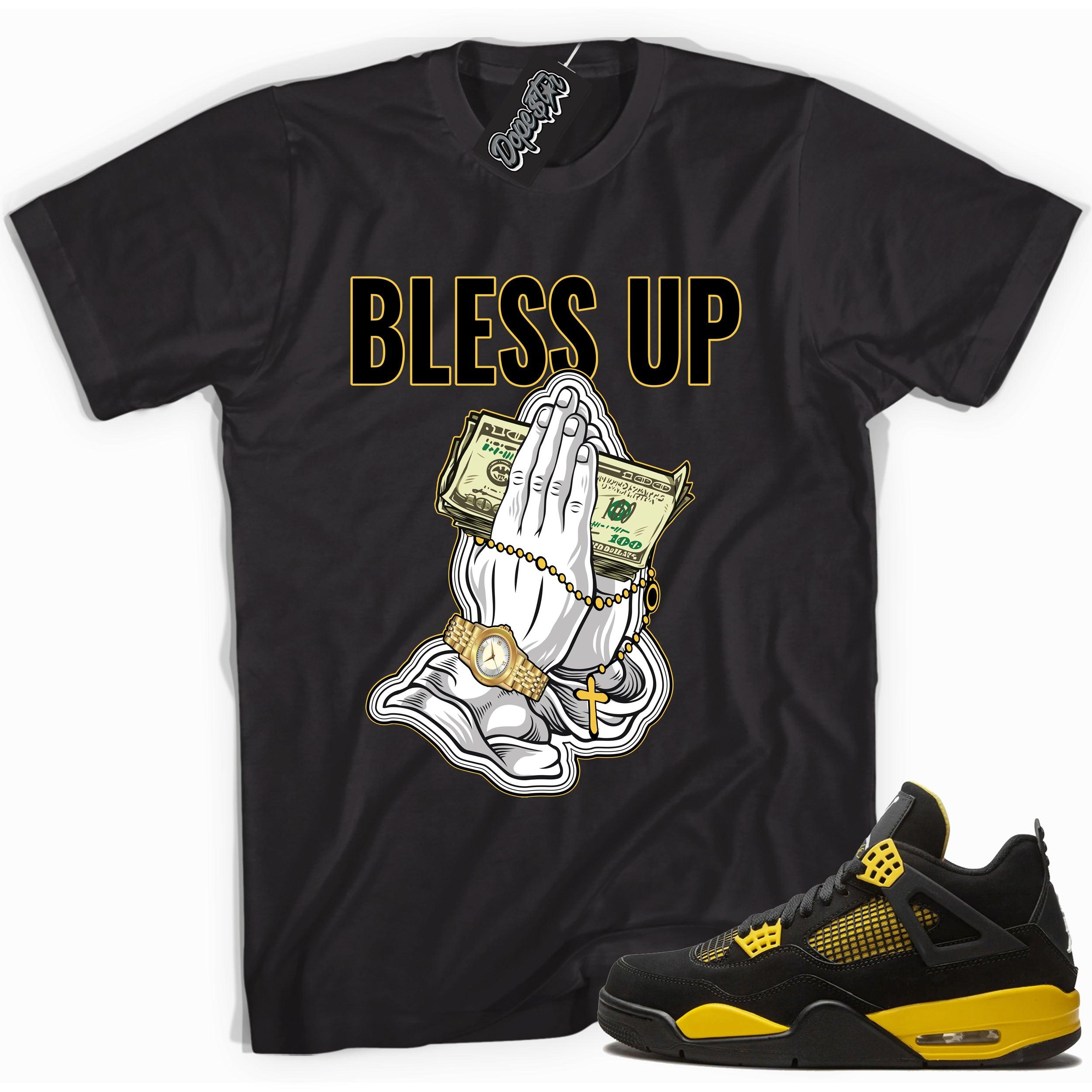 Cool black graphic tee with 'bless up' print, that perfectly matches  Air Jordan 4 Thunder sneakers