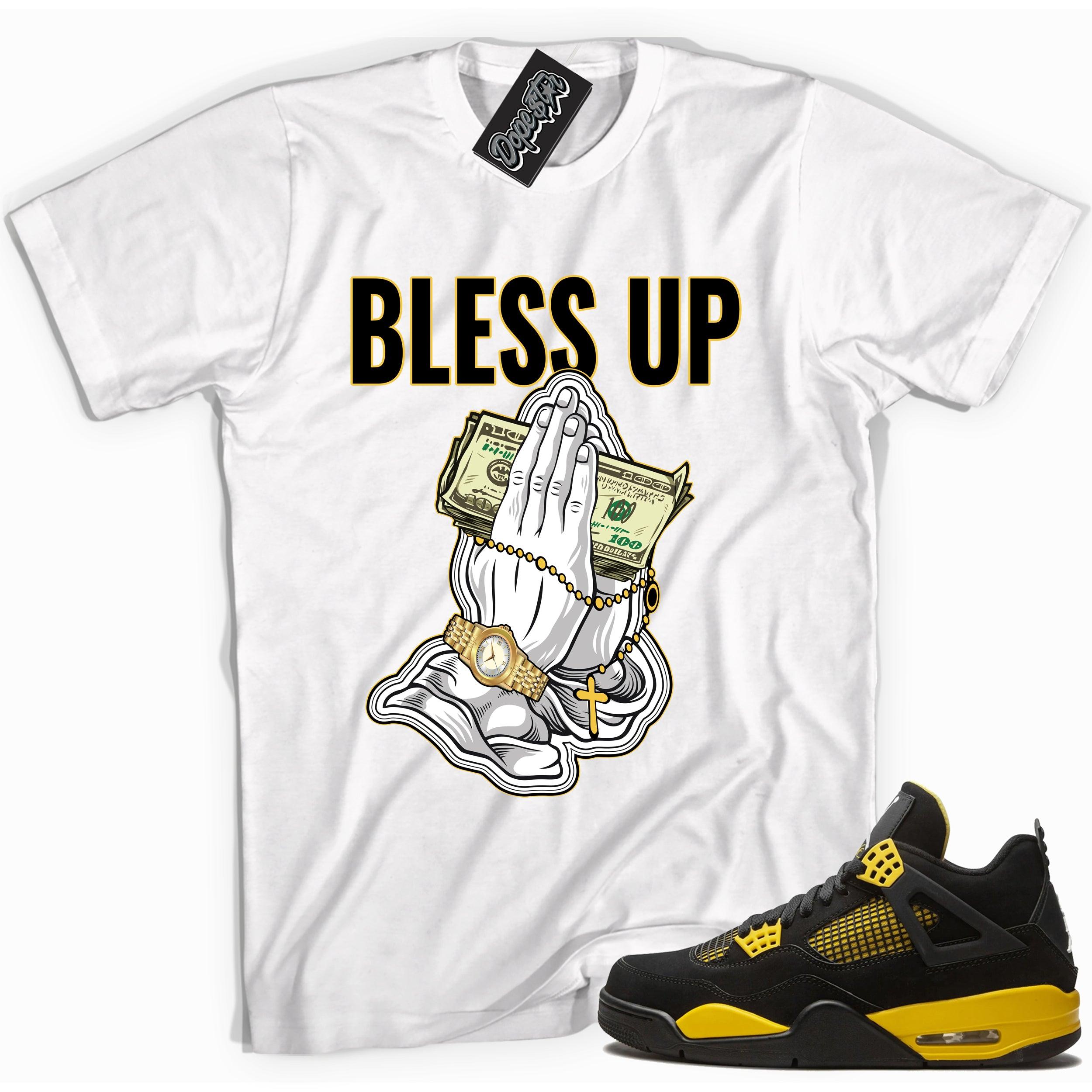 Cool white graphic tee with 'bless up' print, that perfectly matches Air Jordan 4 Thunder sneakers
