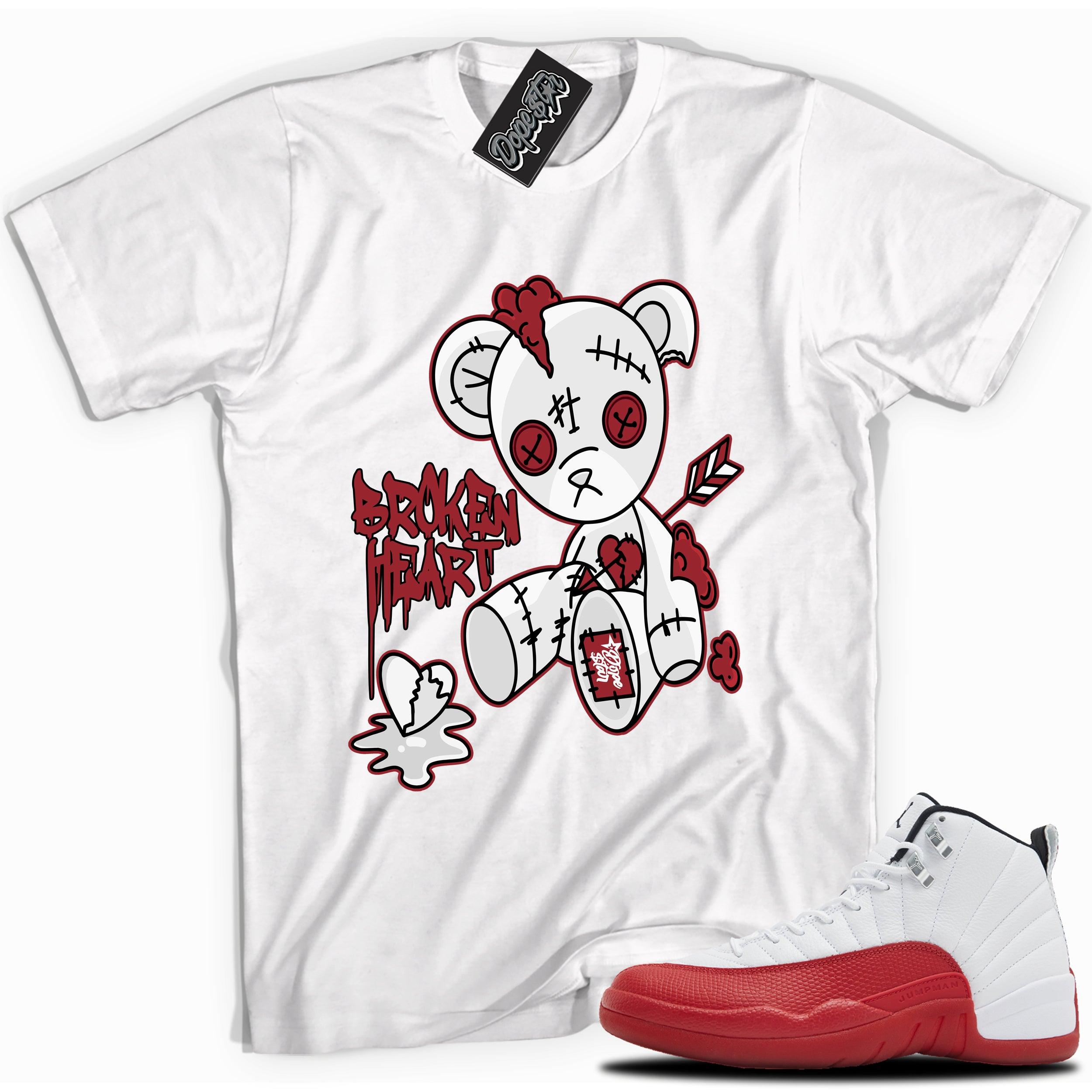 Cool White graphic tee with “ Broken Heart Bear ” print, that perfectly matches Air Jordan 12 Retro Cherry Red 2023 red and white sneakers 