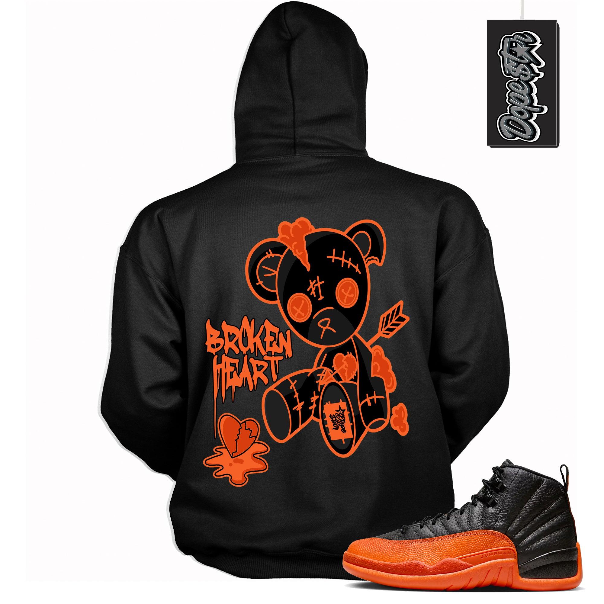 Cool Black Graphic Hoodie with “ Broken Heart Bear “ print, that perfectly matches Air Jordan 12 Retro WNBA All-Star Brilliant Orange  sneakers