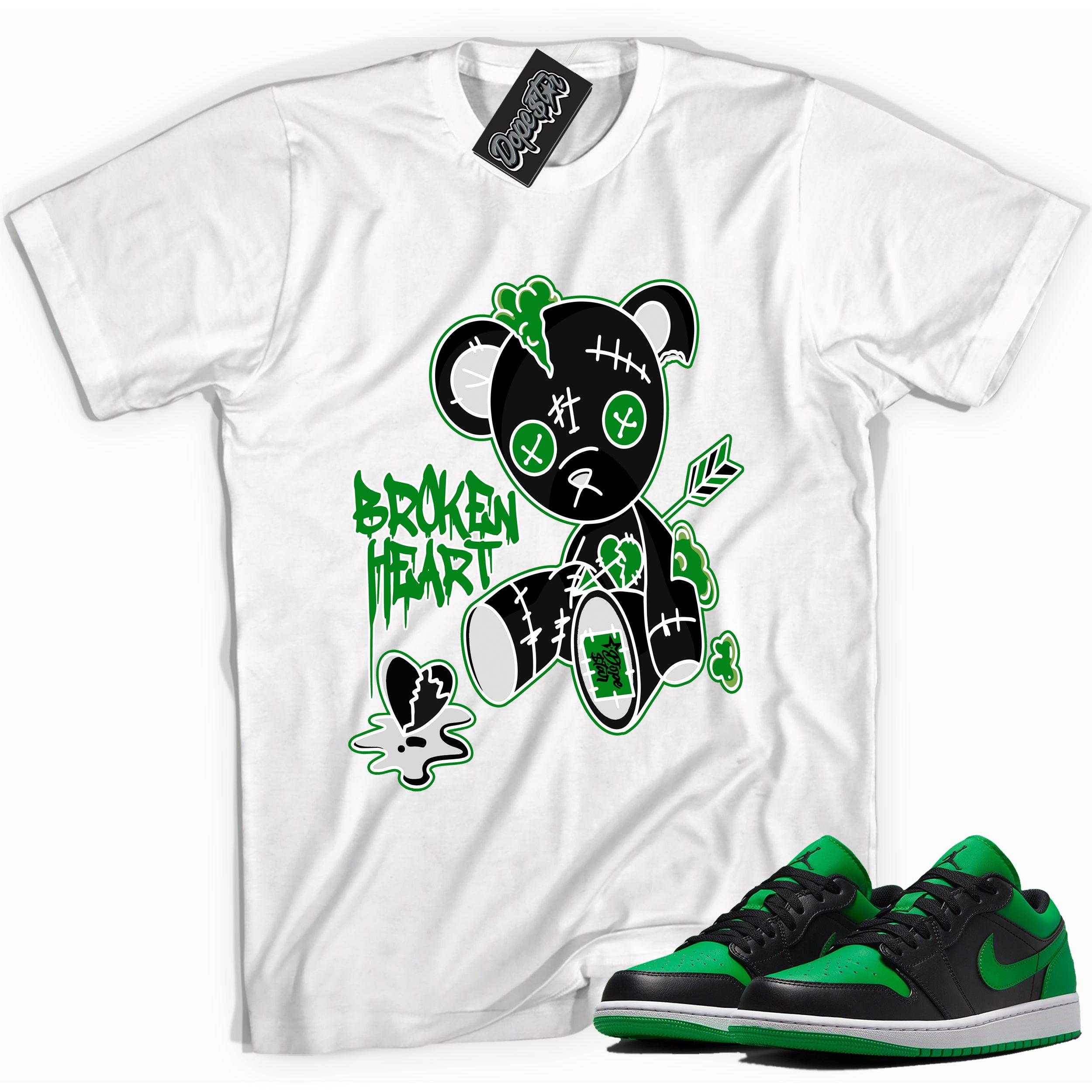 Cool white graphic tee with 'Broken Heart Bear' print, that perfectly matches Air Jordan 1 Low Lucky Green sneakers