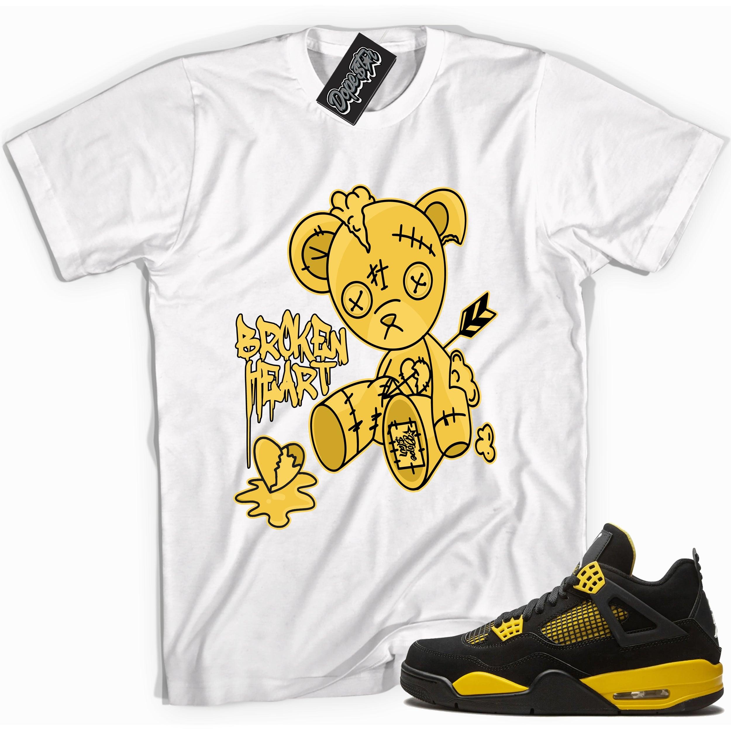Cool white graphic tee with 'broken heart bear' print, that perfectly matches Air Jordan 4 Thunder sneakers