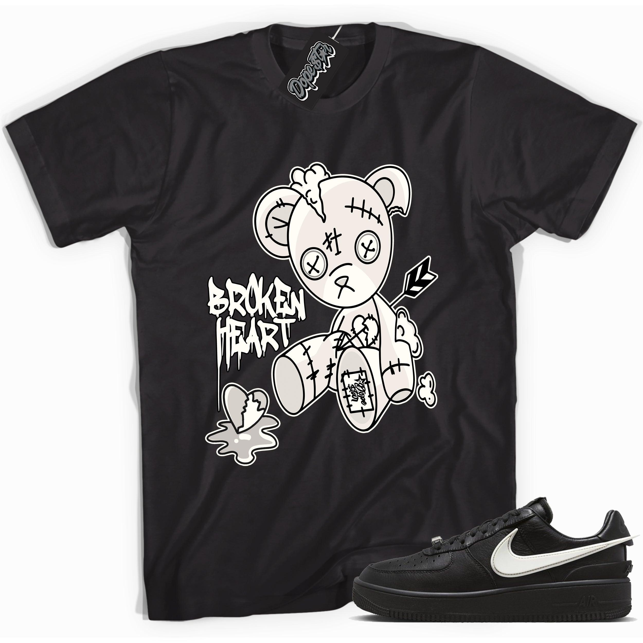 Cool black graphic tee with 'broken heart bear' print, that perfectly matches Nike Air Force 1 Low SP Ambush Phantom sneakers.