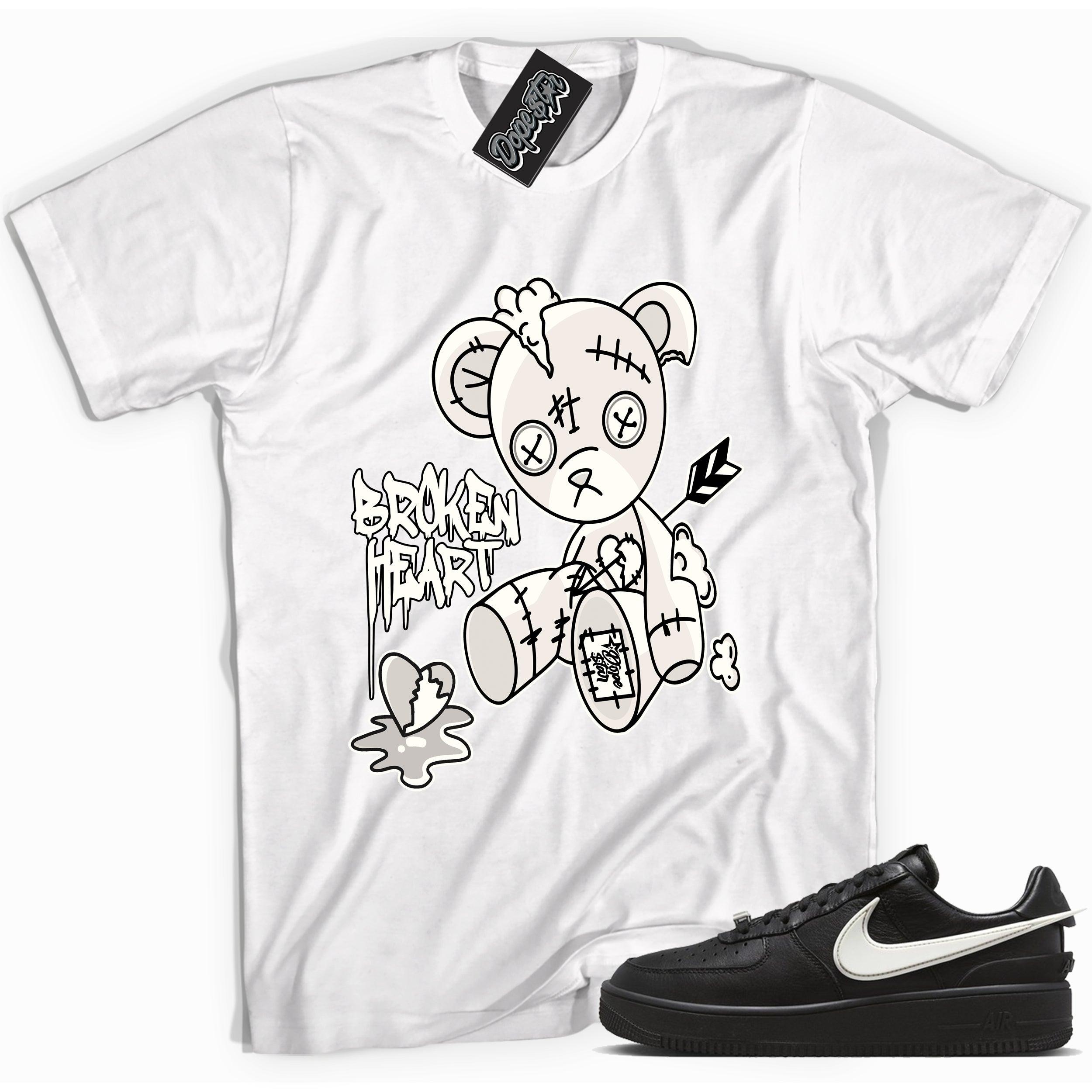Cool white graphic tee with 'broken heart bear' print, that perfectly matches Nike Air Force 1 Low SP Ambush Phantom sneakers.