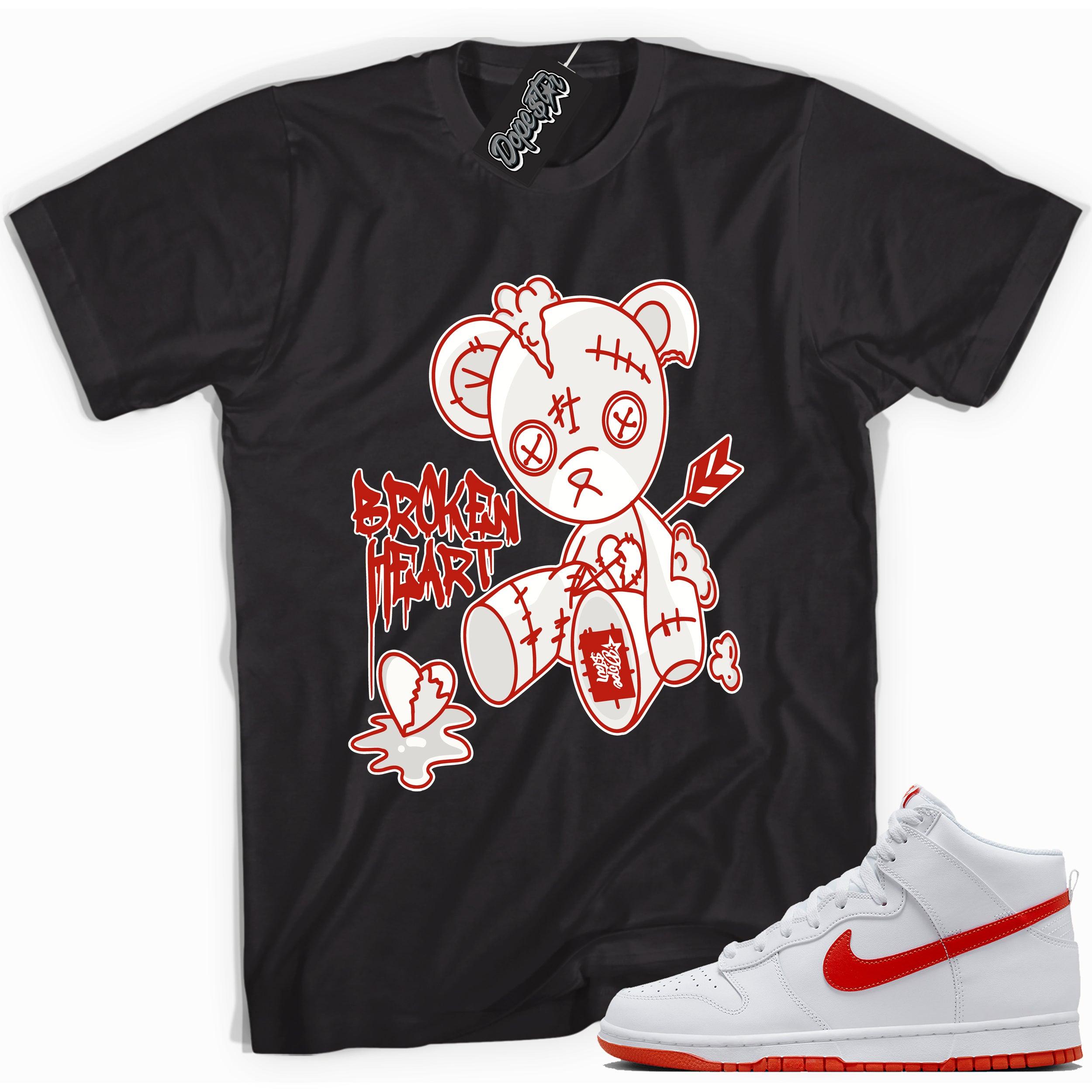 Cool black graphic tee with 'broken heart bear' print, that perfectly matches Nike Dunk High White Picante Red sneakers.