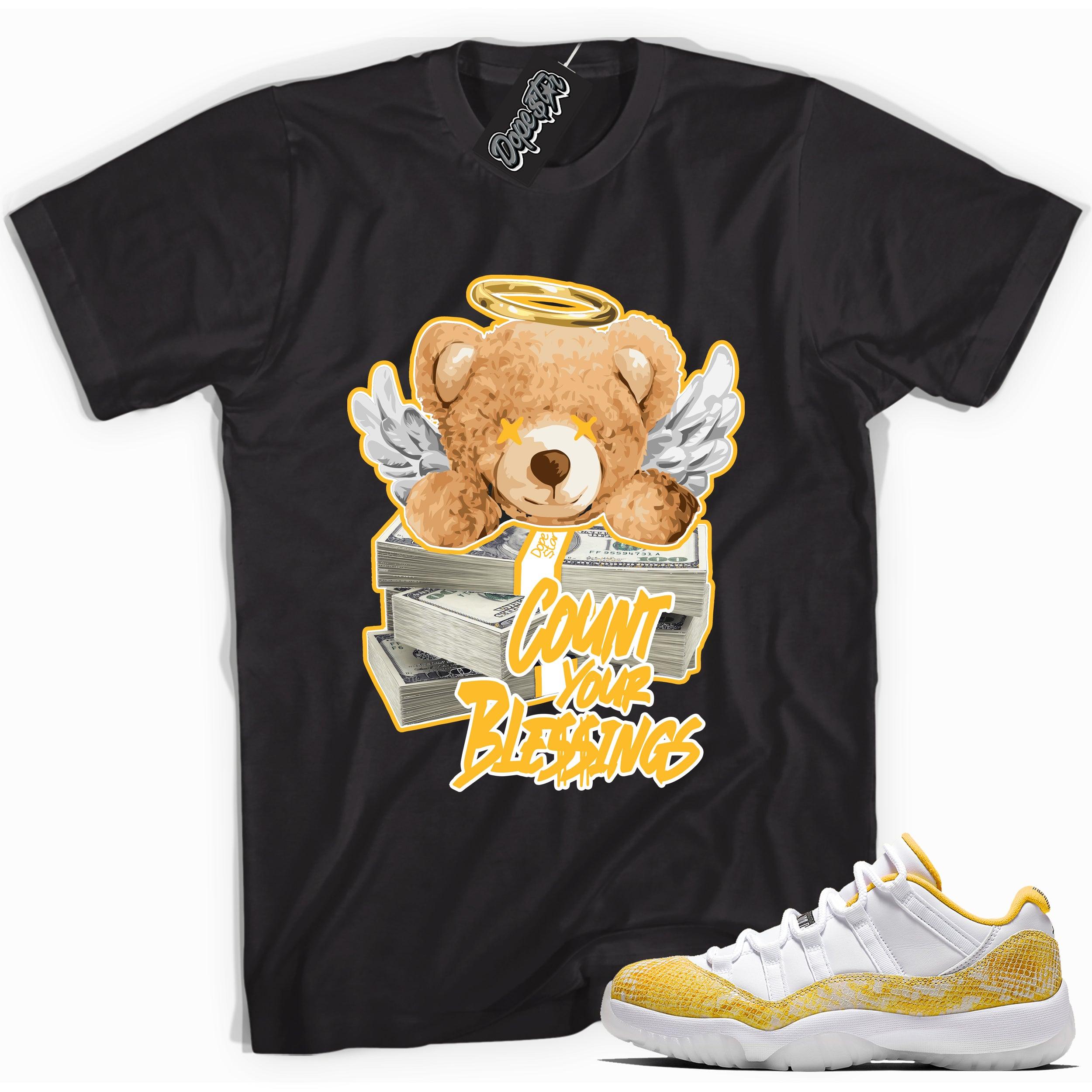Cool black graphic tee with 'count your blessings' print, that perfectly matches  Air Jordan 11 Low Yellow Snakeskin sneakers