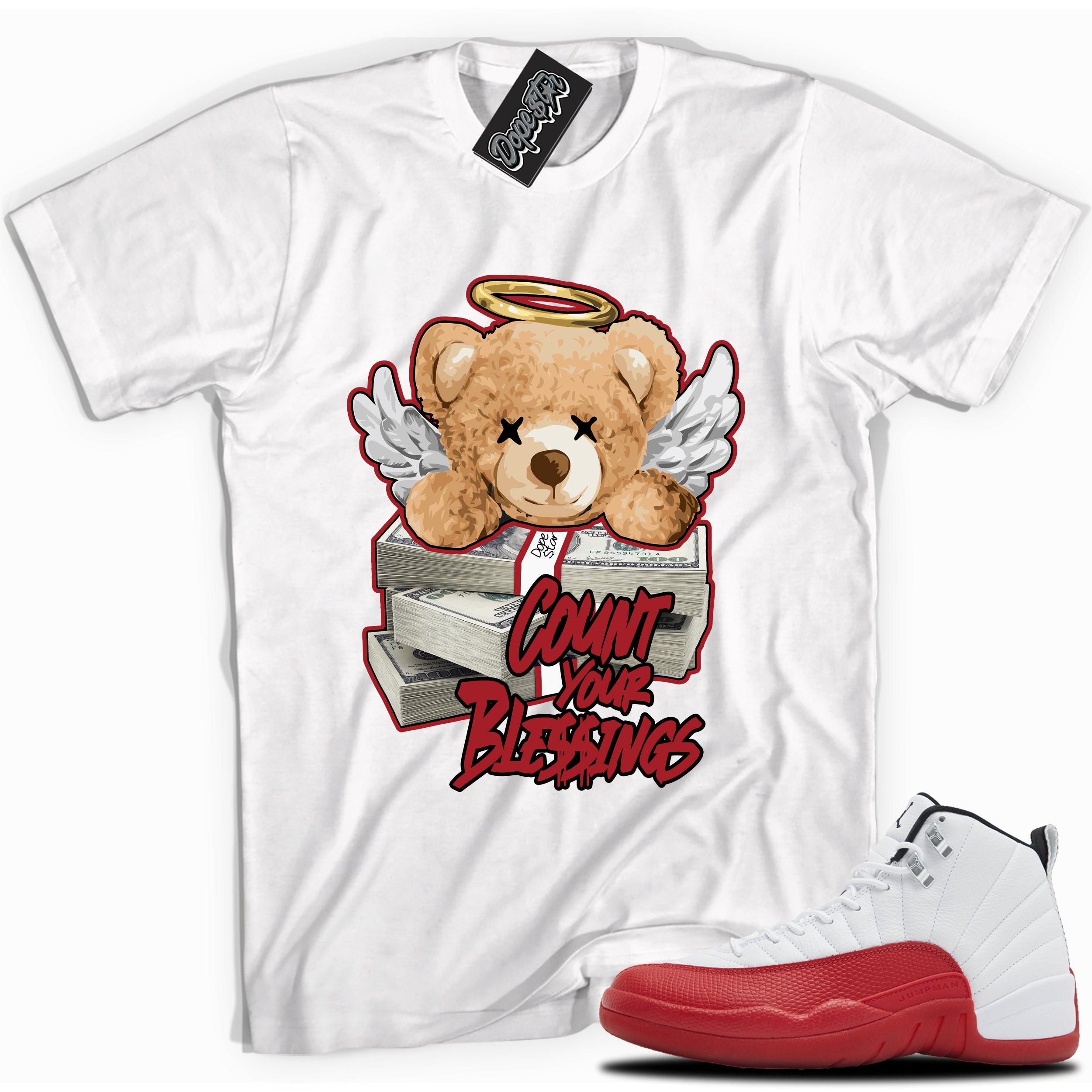 Cool White graphic tee with “ Count Your Blessings ” print, that perfectly matches Air Jordan 12 Retro Cherry Red 2023 red and white sneakers