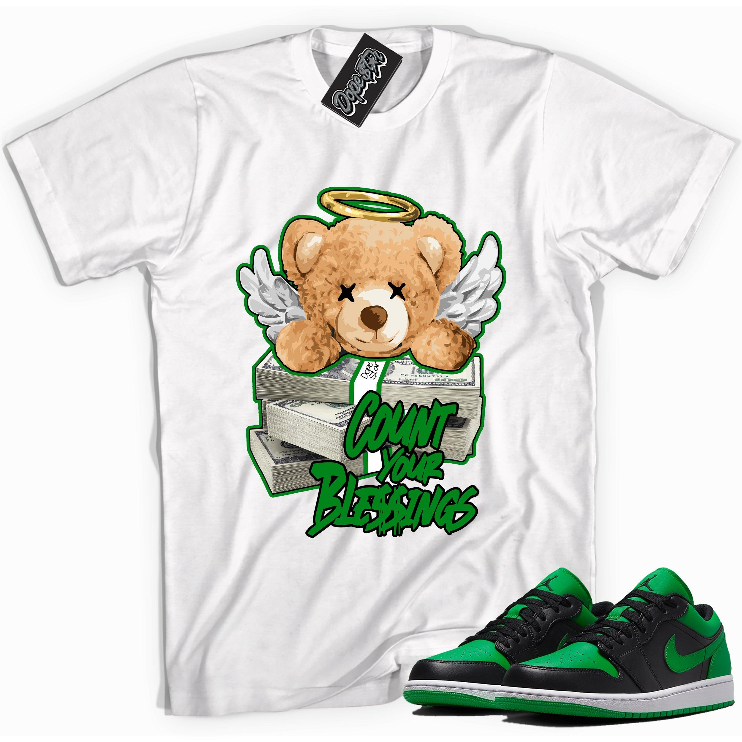 Cool white graphic tee with 'Count Your Blessings' print, that perfectly matches Air Jordan 1 Low Lucky Green sneakers